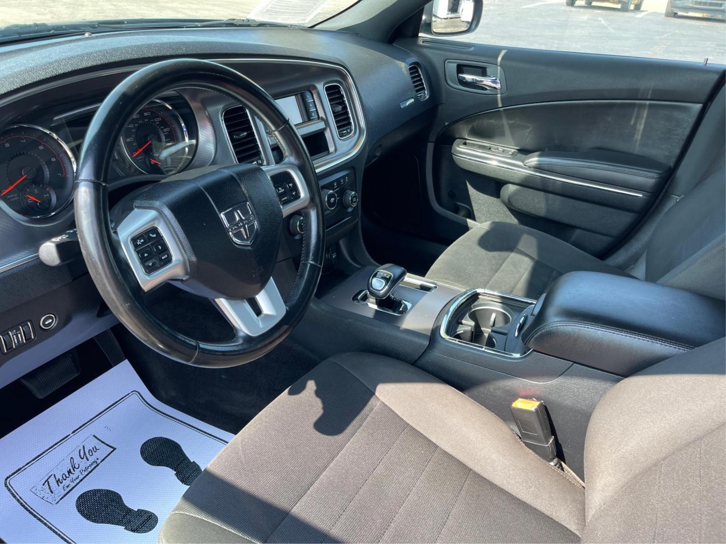 2012 Pitch Black Dodge Charger SE (2C3CDXBGXCH) with an 3.6L V6 DOHC 24V engine, 5-Speed Automatic transmission, located at 1099 N County Rd 25A, OH, 45373, (937) 908-9800, 40.057079, -84.212883 - Photo#8