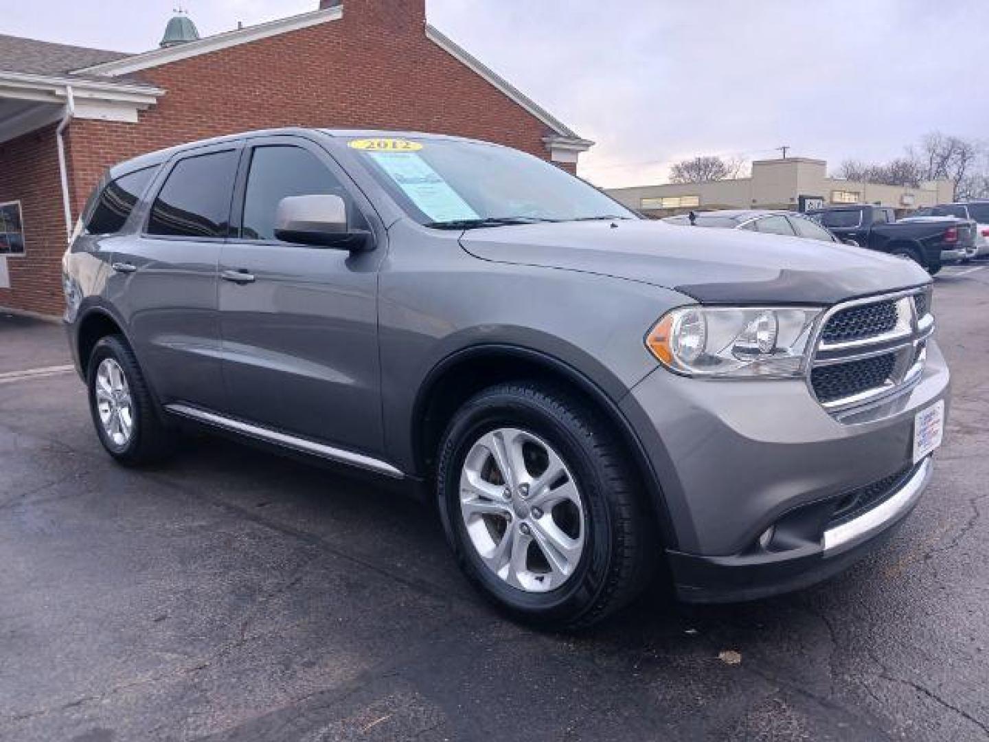 2012 Mineral Gray Metallic Dodge Durango SXT AWD (1C4RDJAGXCC) with an 3.6L V6 DOHC 24V engine, 5-Speed Automatic transmission, located at 1951 S Dayton Lakeview Rd., New Carlisle, OH, 45344, (937) 908-9800, 39.890999, -84.050255 - Photo#0