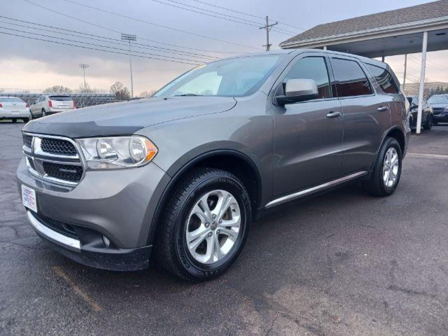 2012 Mineral Gray Metallic Dodge Durango SXT AWD (1C4RDJAGXCC) with an 3.6L V6 DOHC 24V engine, 5-Speed Automatic transmission, located at 1951 S Dayton Lakeview Rd., New Carlisle, OH, 45344, (937) 908-9800, 39.890999, -84.050255 - Photo#2