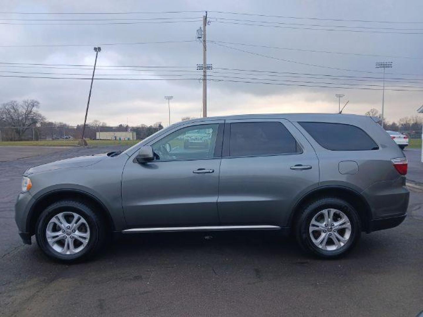 2012 Mineral Gray Metallic Dodge Durango SXT AWD (1C4RDJAGXCC) with an 3.6L V6 DOHC 24V engine, 5-Speed Automatic transmission, located at 1951 S Dayton Lakeview Rd., New Carlisle, OH, 45344, (937) 908-9800, 39.890999, -84.050255 - Photo#3