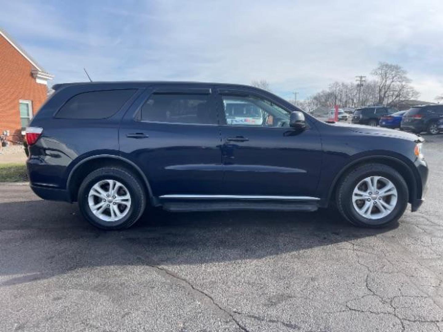 2012 True Blue Pearl Dodge Durango SXT AWD (1C4RDJAGXCC) with an 3.6L V6 DOHC 24V engine, 5-Speed Automatic transmission, located at 401 Woodman Dr, Riverside, OH, 45431, (937) 908-9800, 39.763779, -84.122063 - Photo#2