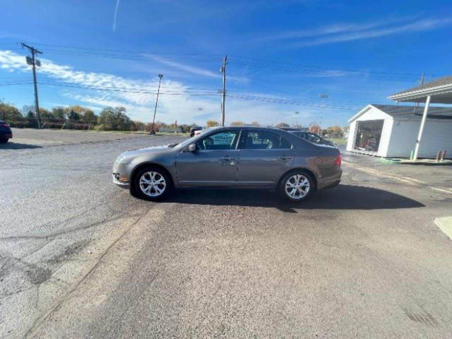 2012 Sterling Gray Metallic Ford Fusion SE (3FAHP0HA5CR) with an 2.5L L4 DOHC 16V engine, located at 880 E. National Road, Vandalia, OH, 45377, (937) 908-9800, 39.892189, -84.181015 - Photo#3