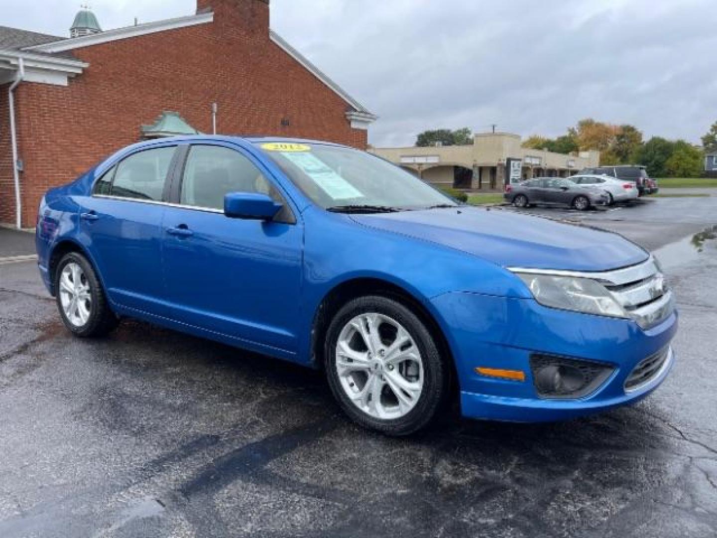 2012 Blue Flame Metallic Ford Fusion SE (3FAHP0HG6CR) with an 3.0L V6 DOHC 24V engine, located at 401 Woodman Dr, Riverside, OH, 45431, (937) 908-9800, 39.763779, -84.122063 - Photo#0