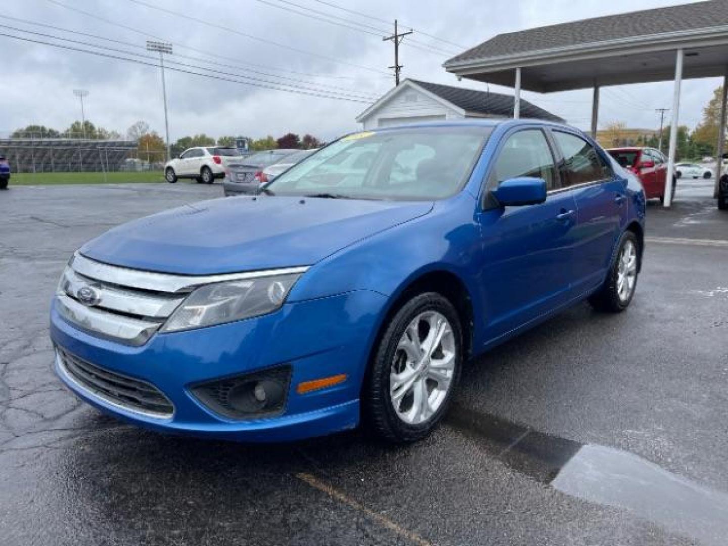 2012 Blue Flame Metallic Ford Fusion SE (3FAHP0HG6CR) with an 3.0L V6 DOHC 24V engine, located at 401 Woodman Dr, Riverside, OH, 45431, (937) 908-9800, 39.763779, -84.122063 - Photo#1