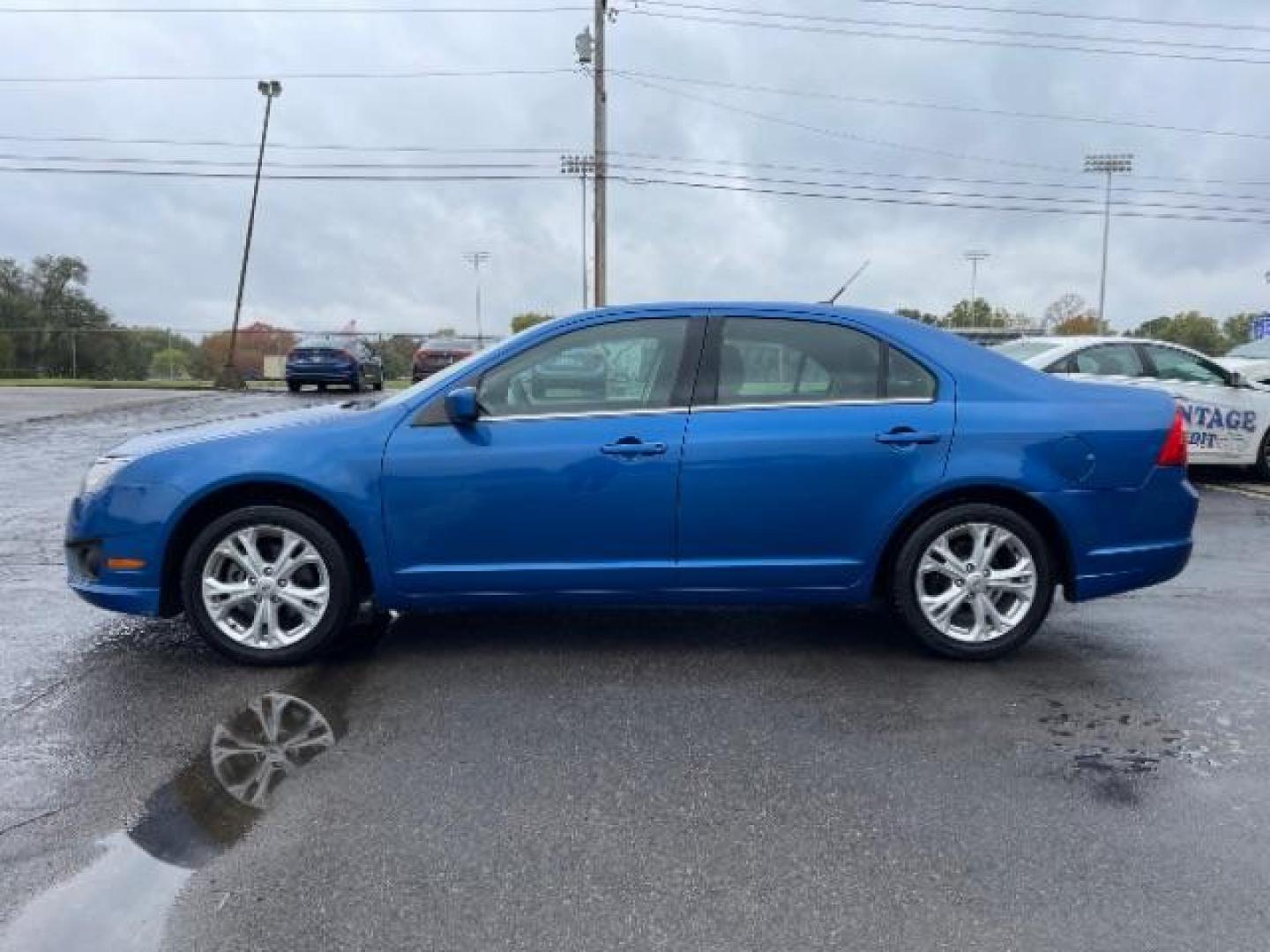 2012 Blue Flame Metallic Ford Fusion SE (3FAHP0HG6CR) with an 3.0L V6 DOHC 24V engine, located at 401 Woodman Dr, Riverside, OH, 45431, (937) 908-9800, 39.763779, -84.122063 - Photo#5