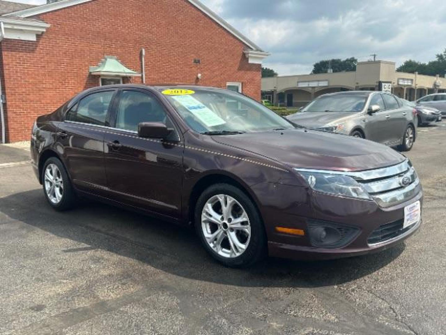 2012 Cinnamon Metallic Ford Fusion SE (3FAHP0HA1CR) with an 2.5L L4 DOHC 16V engine, located at 1230 East Main St, Xenia, OH, 45385, (937) 908-9800, 39.687321, -83.910294 - Photo#0