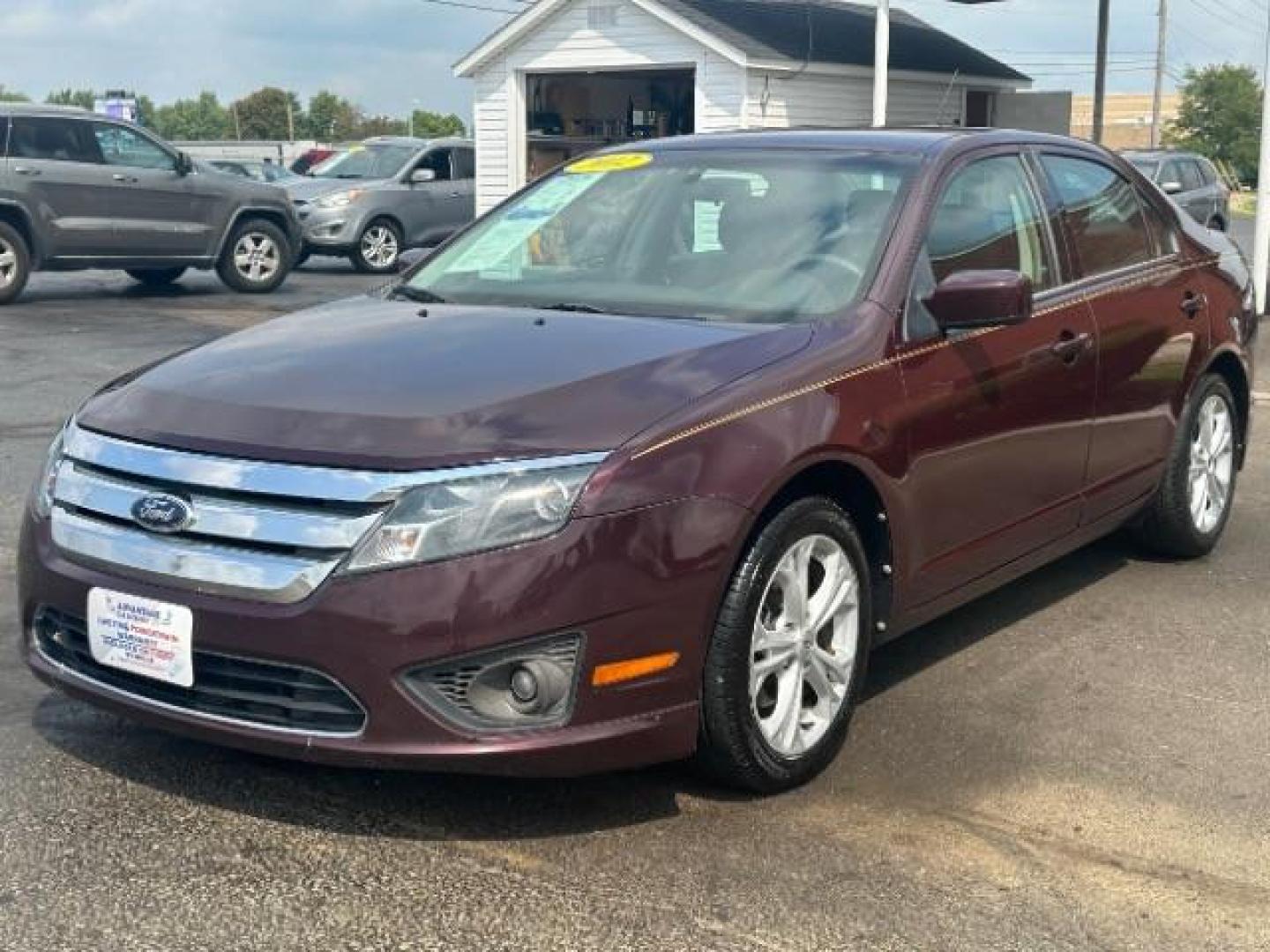 2012 Cinnamon Metallic Ford Fusion SE (3FAHP0HA1CR) with an 2.5L L4 DOHC 16V engine, located at 1230 East Main St, Xenia, OH, 45385, (937) 908-9800, 39.687321, -83.910294 - Photo#2