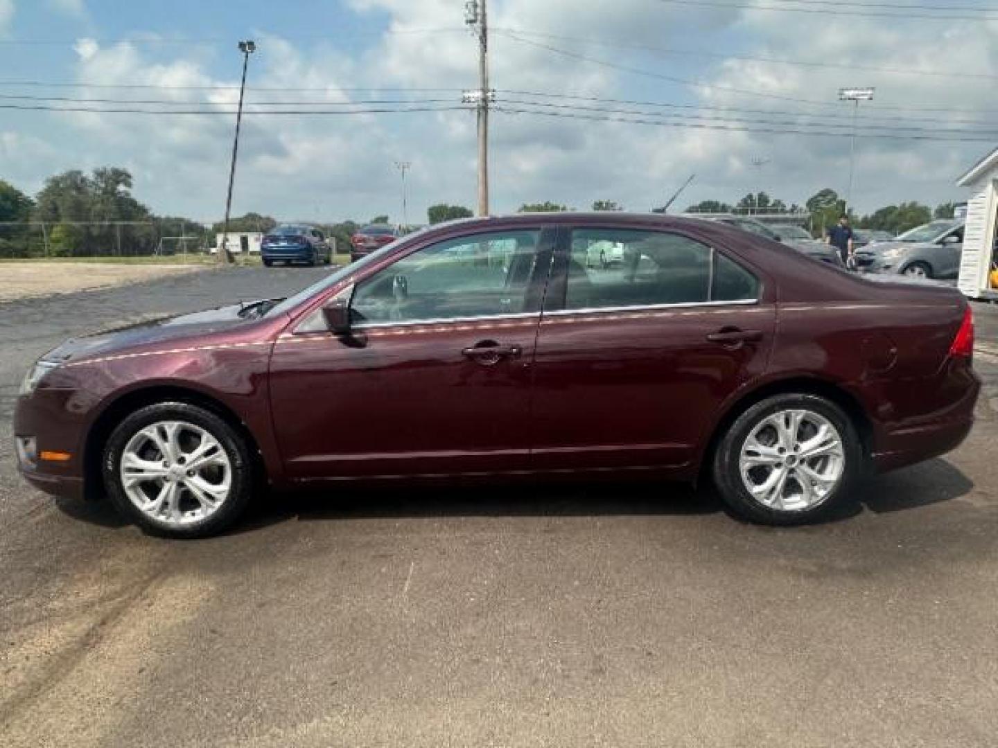 2012 Cinnamon Metallic Ford Fusion SE (3FAHP0HA1CR) with an 2.5L L4 DOHC 16V engine, located at 1230 East Main St, Xenia, OH, 45385, (937) 908-9800, 39.687321, -83.910294 - Photo#3