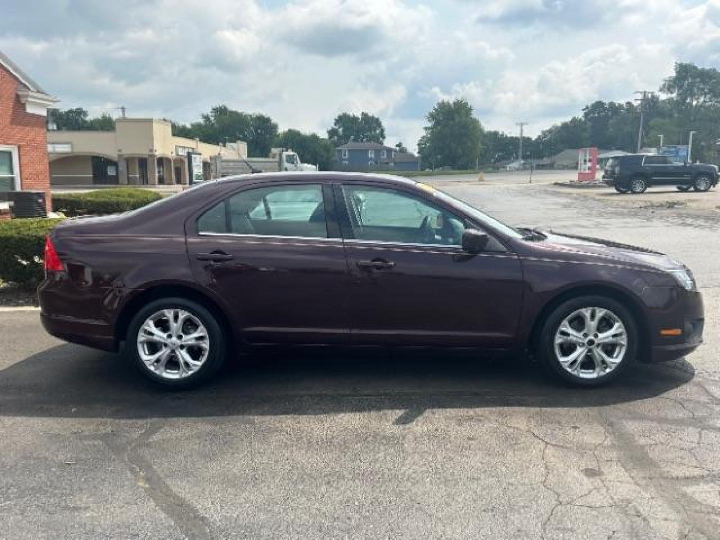 2012 Cinnamon Metallic Ford Fusion SE (3FAHP0HA1CR) with an 2.5L L4 DOHC 16V engine, located at 1230 East Main St, Xenia, OH, 45385, (937) 908-9800, 39.687321, -83.910294 - Photo#5