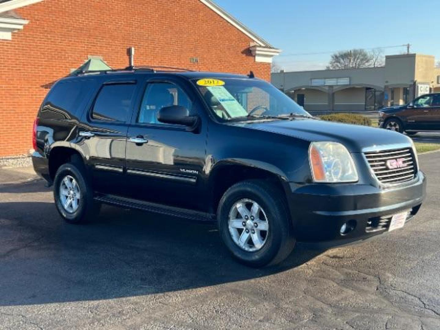 2012 Onyx Black GMC Yukon SLT1 4WD (1GKS2CE03CR) with an 5.3L V8 OHV 16V FFV engine, 6-Speed Automatic transmission, located at 1099 N County Rd 25A, OH, 45373, (937) 908-9800, 40.057079, -84.212883 - Photo#0