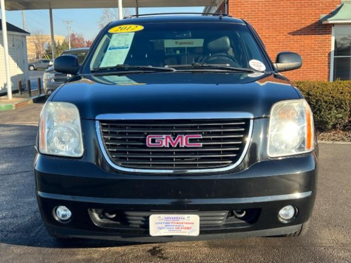 2012 Onyx Black GMC Yukon SLT1 4WD (1GKS2CE03CR) with an 5.3L V8 OHV 16V FFV engine, 6-Speed Automatic transmission, located at 1099 N County Rd 25A, OH, 45373, (937) 908-9800, 40.057079, -84.212883 - Photo#1