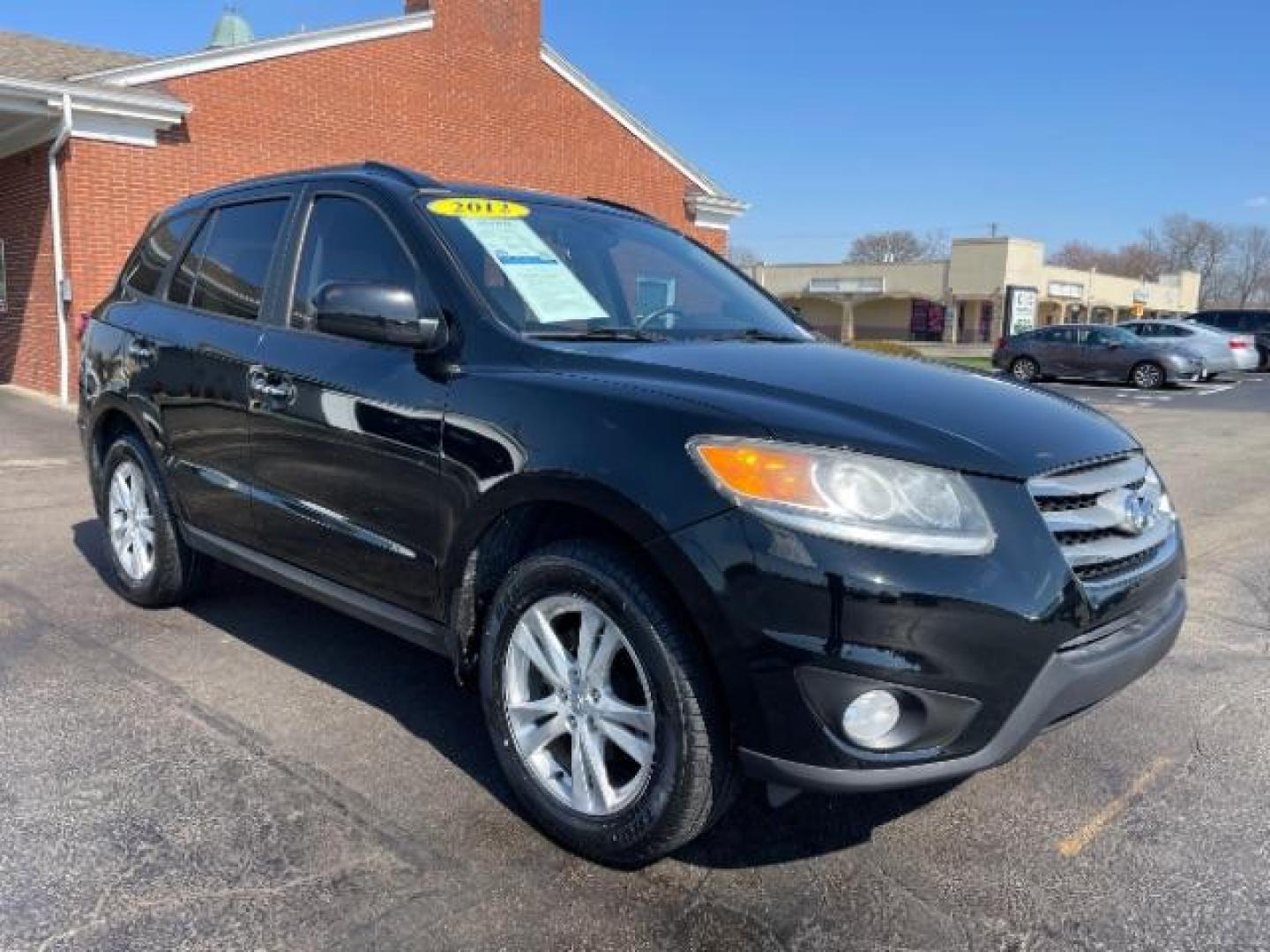 2012 Twilight Black Hyundai Santa Fe Limited 2.4 FWD (5XYZK3AB2CG) with an 2.4L L4 DOHC 16V engine, 6-Speed Automatic transmission, located at 4508 South Dixie Dr, Moraine, OH, 45439, (937) 908-9800, 39.690136, -84.216438 - Photo#0