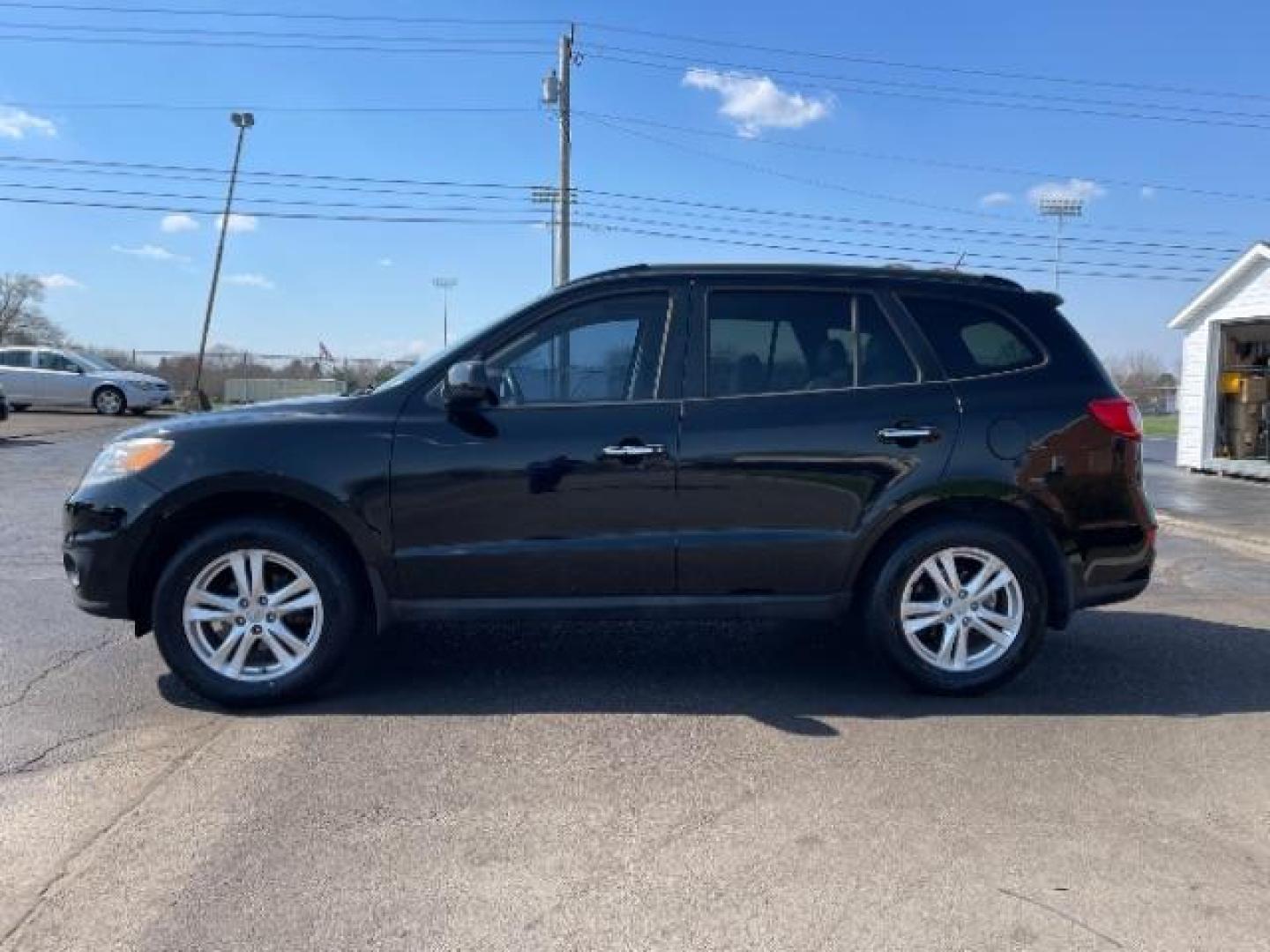 2012 Twilight Black Hyundai Santa Fe Limited 2.4 FWD (5XYZK3AB2CG) with an 2.4L L4 DOHC 16V engine, 6-Speed Automatic transmission, located at 4508 South Dixie Dr, Moraine, OH, 45439, (937) 908-9800, 39.690136, -84.216438 - Photo#2