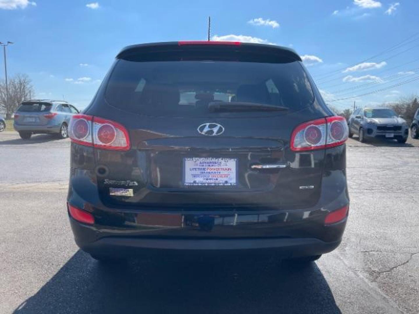 2012 Twilight Black Hyundai Santa Fe Limited 2.4 FWD (5XYZK3AB2CG) with an 2.4L L4 DOHC 16V engine, 6-Speed Automatic transmission, located at 4508 South Dixie Dr, Moraine, OH, 45439, (937) 908-9800, 39.690136, -84.216438 - Photo#5