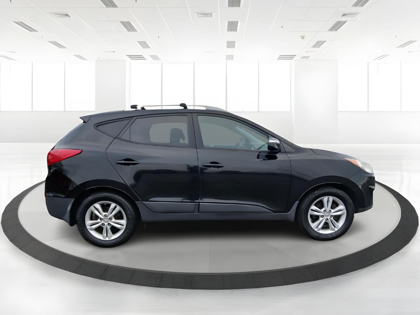 2012 Hyundai Tucson GLS AWD (KM8JUCACXCU) with an 2.4L L4 DOHC 16V engine, 6-Speed Automatic transmission, located at 1951 S Dayton Lakeview Rd., New Carlisle, OH, 45344, (937) 908-9800, 39.890999, -84.050255 - 2012 Hyundai Tucson GLS AWD - Photo#1