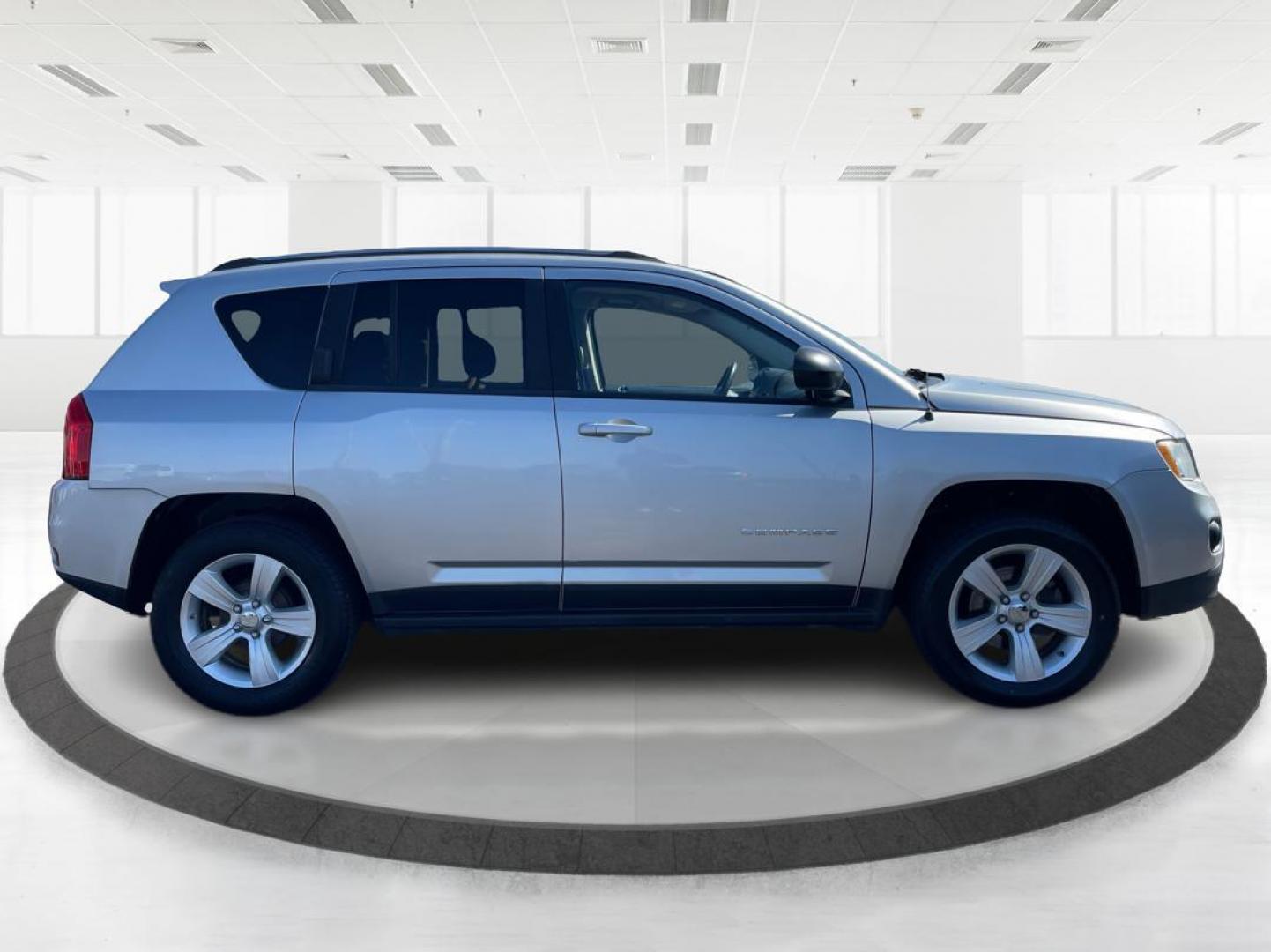 2012 Bright Silver Metallic Jeep Compass Latitude FWD (1C4NJCEB1CD) with an 2.4L L4 DOHC 16V engine, Continuously Variable Transmission transmission, located at 880 E. National Road, Vandalia, OH, 45377, (937) 908-9800, 39.892189, -84.181015 - Photo#1