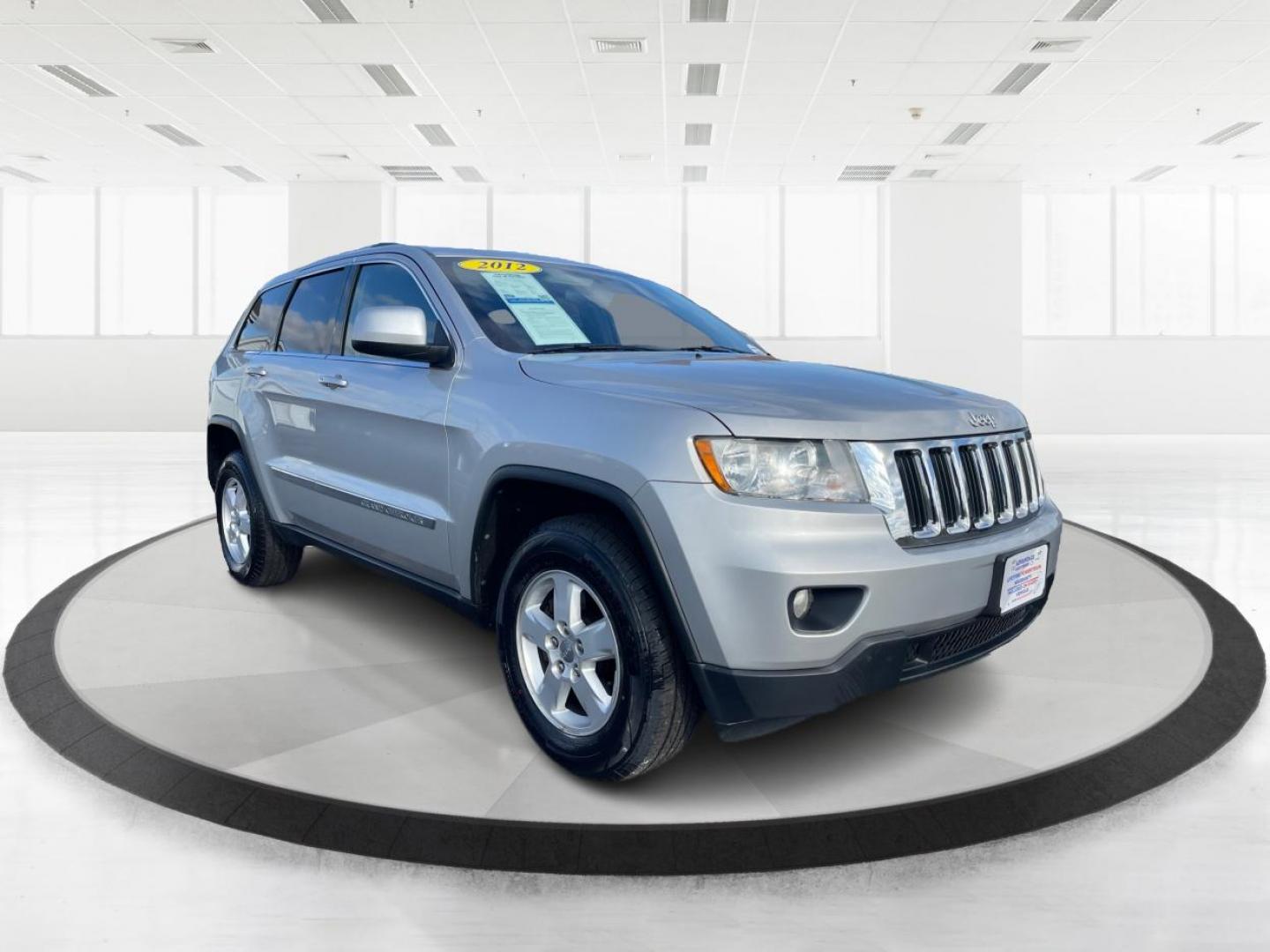 2012 Jeep Grand Cherokee Laredo 4WD (1C4RJFAG2CC) with an 3.6L V6 DOHC 24V engine, 5-Speed Automatic transmission, located at 1099 N County Rd 25A, Troy, OH, 45373, (937) 908-9800, 40.057079, -84.212883 - 2012 Jeep Grand Cherokee Laredo 4WD - Photo#0