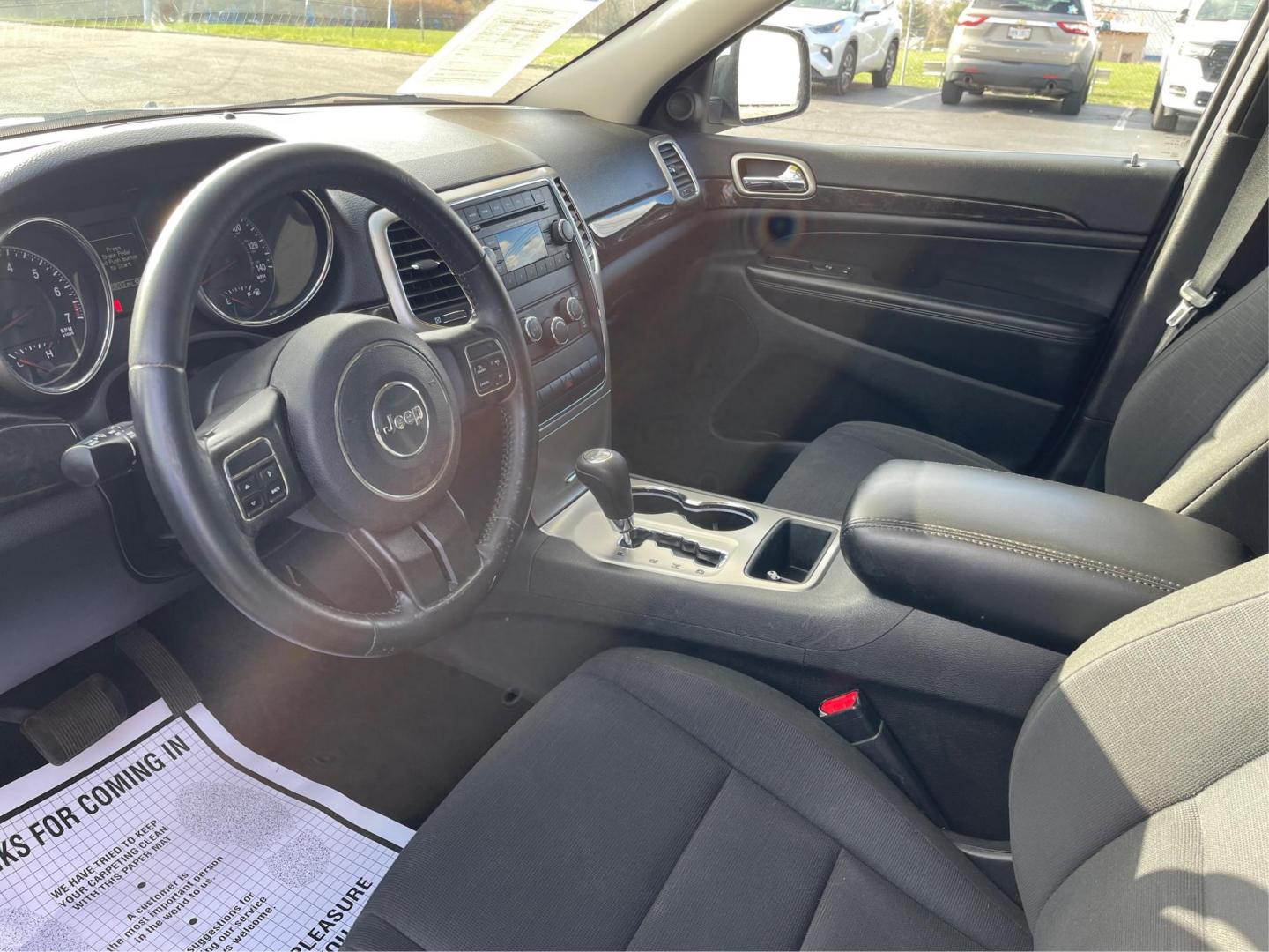 2012 Jeep Grand Cherokee Laredo 4WD (1C4RJFAG2CC) with an 3.6L V6 DOHC 24V engine, 5-Speed Automatic transmission, located at 1099 N County Rd 25A, Troy, OH, 45373, (937) 908-9800, 40.057079, -84.212883 - 2012 Jeep Grand Cherokee Laredo 4WD - Photo#8