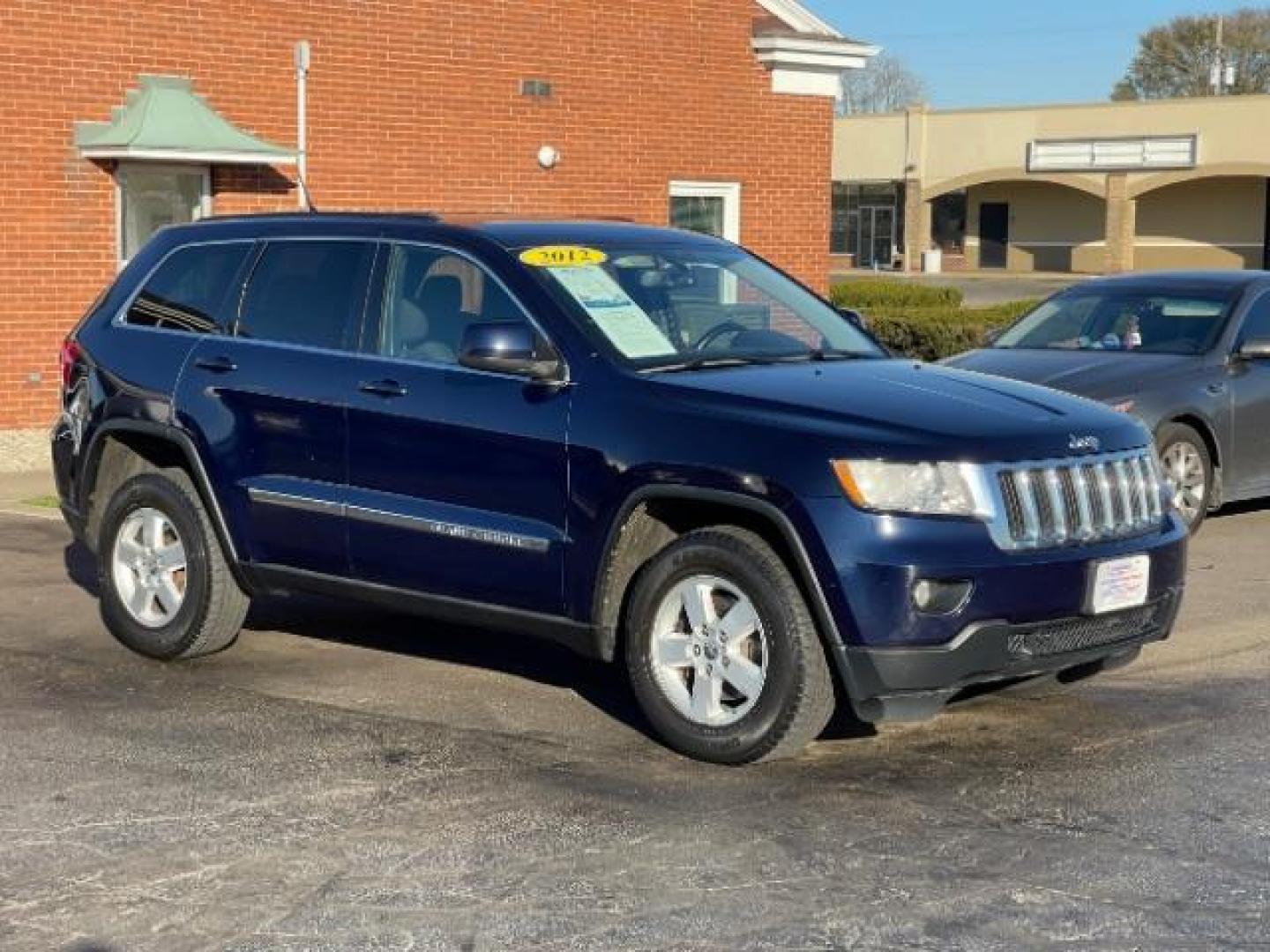 2012 True Blue Pearl Jeep Grand Cherokee Laredo 4WD (1C4RJFAGXCC) with an 3.6L V6 DOHC 24V engine, 5-Speed Automatic transmission, located at 880 E. National Road, Vandalia, OH, 45377, (937) 908-9800, 39.892189, -84.181015 - Photo#0