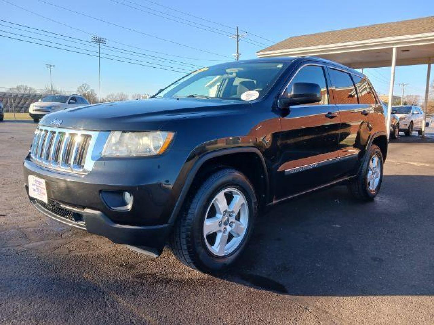 2012 Brilliant Black Crystal Pearl Jeep Grand Cherokee Laredo 4WD (1C4RJFAG1CC) with an 3.6L V6 DOHC 24V engine, 5-Speed Automatic transmission, located at 1184 Kauffman Ave, Fairborn, OH, 45324, (937) 908-9800, 39.807365, -84.029114 - Photo#2