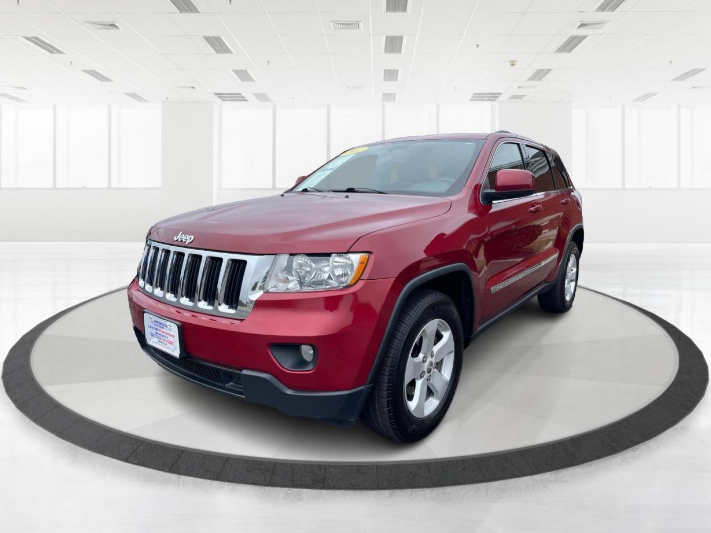 2012 Deep Cherry Red Crystal Pearl Jeep Grand Cherokee Laredo 4WD (1C4RJFAG6CC) with an 3.6L V6 DOHC 24V engine, 5-Speed Automatic transmission, located at 1230 East Main St, Xenia, OH, 45385, (937) 908-9800, 39.687321, -83.910294 - Photo#7