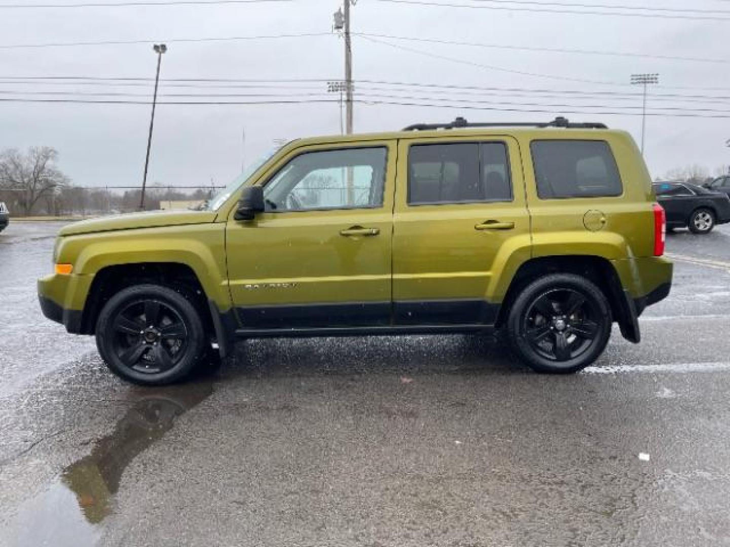 2012 Rescue Green Metallic Jeep Patriot Latitude 4WD (1C4NJRFB8CD) with an 2.4L L4 DOHC 16V engine, located at 1099 N County Rd 25A, OH, 45373, (937) 908-9800, 40.057079, -84.212883 - Photo#2