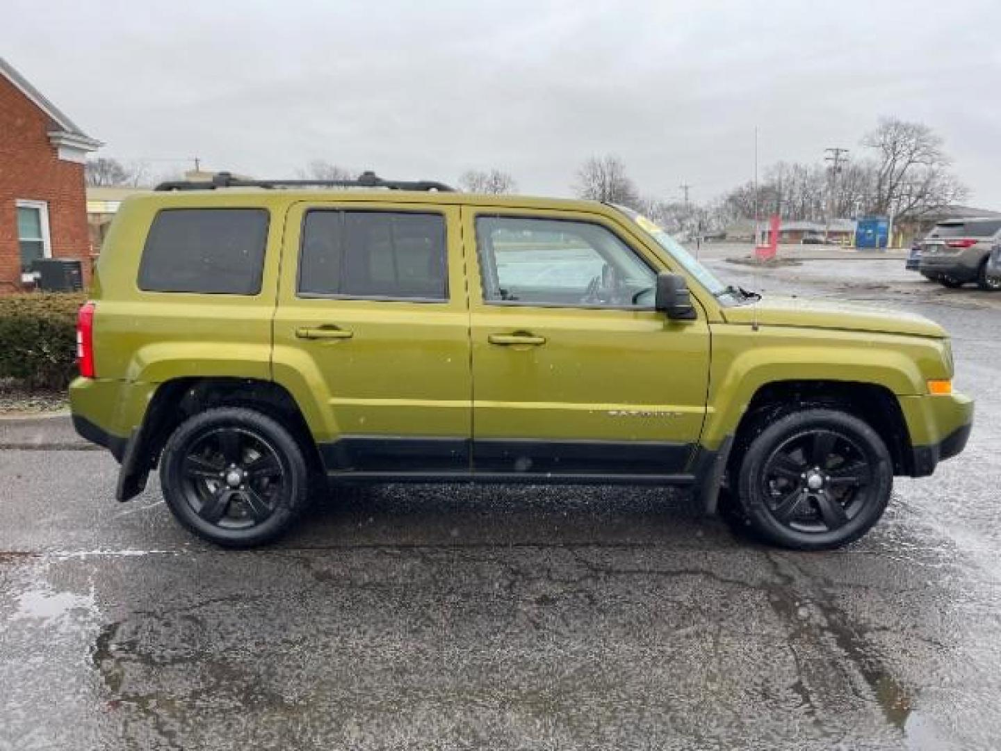 2012 Rescue Green Metallic Jeep Patriot Latitude 4WD (1C4NJRFB8CD) with an 2.4L L4 DOHC 16V engine, located at 1099 N County Rd 25A, OH, 45373, (937) 908-9800, 40.057079, -84.212883 - Photo#3