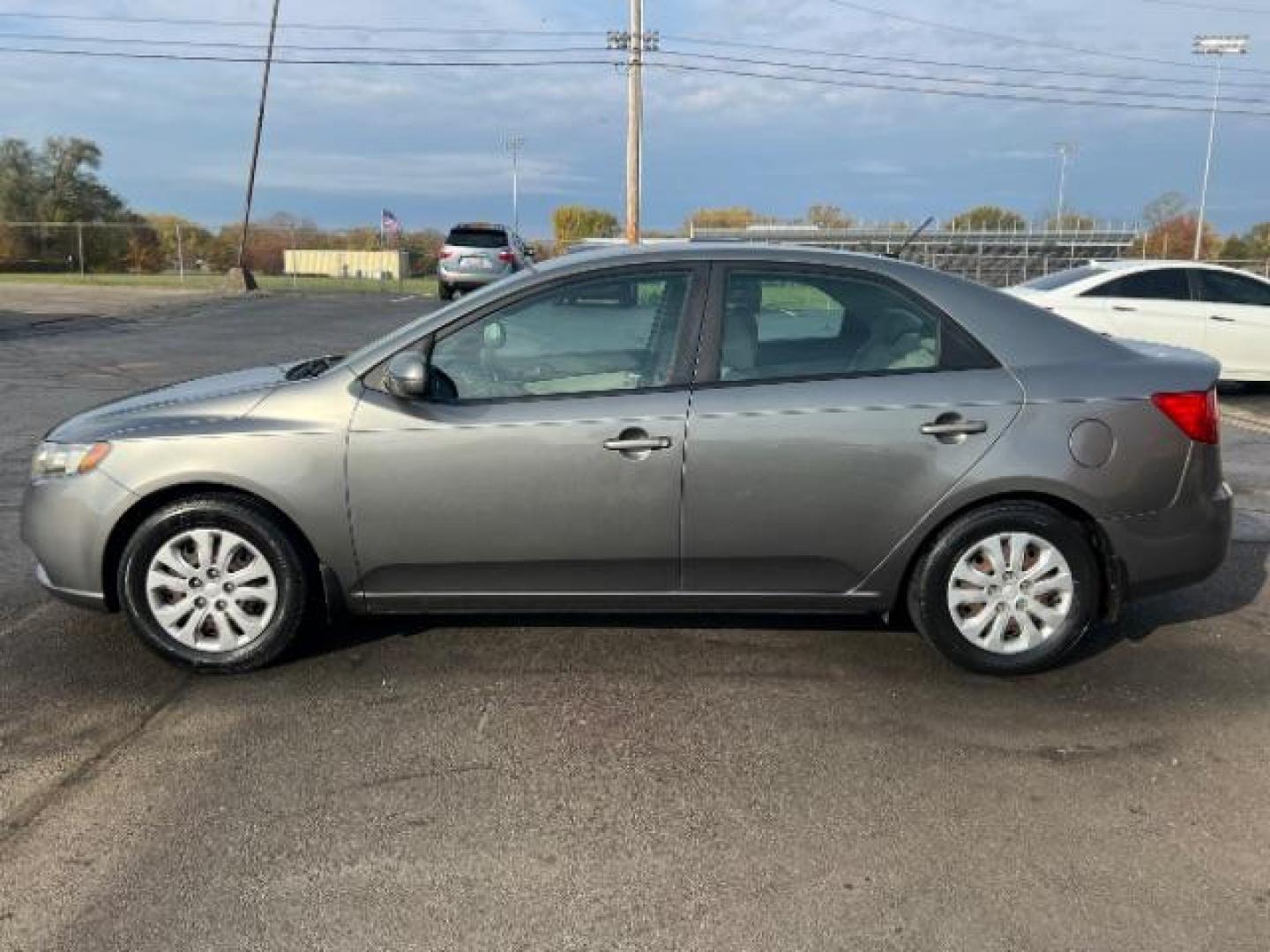 2012 Metal Bronze Metallic Kia Forte EX (KNAFU4A24C5) with an 2.0L L4 DOHC 16V engine, located at 1184 Kauffman Ave, Fairborn, OH, 45324, (937) 908-9800, 39.807365, -84.029114 - Photo#2