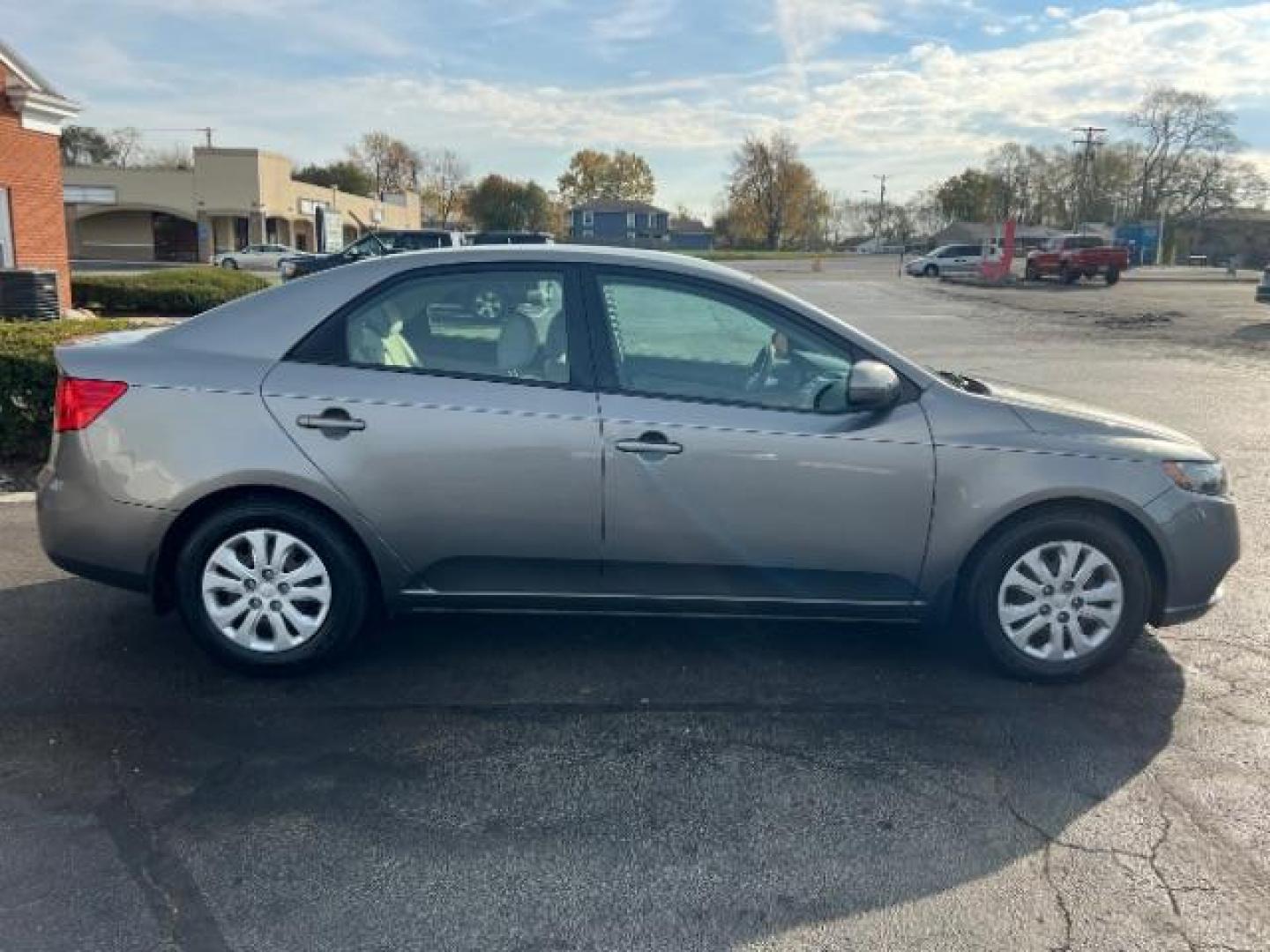 2012 Metal Bronze Metallic Kia Forte EX (KNAFU4A24C5) with an 2.0L L4 DOHC 16V engine, located at 1184 Kauffman Ave, Fairborn, OH, 45324, (937) 908-9800, 39.807365, -84.029114 - Photo#4