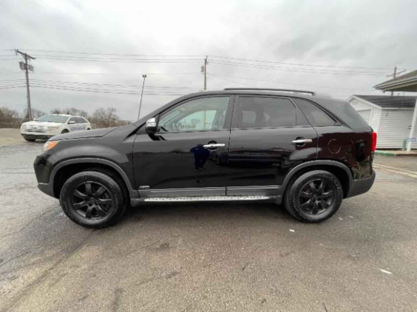 2012 Ebony Black Kia Sorento LX 4WD (5XYKTCA62CG) with an 2.4L L4 DOHC 16V engine, 6-Speed Automatic transmission, located at 4508 South Dixie Dr, Moraine, OH, 45439, (937) 908-9800, 39.690136, -84.216438 - Photo#2