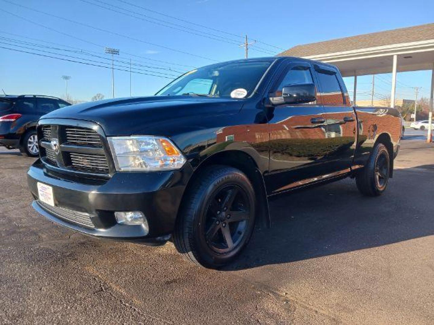 2012 Black RAM 1500 Sport Quad Cab 4WD (1C6RD7HT2CS) with an 5.7L V8 OHV 16V engine, 6-Speed Automatic transmission, located at 401 Woodman Dr, Riverside, OH, 45431, (937) 908-9800, 39.763779, -84.122063 - Photo#2