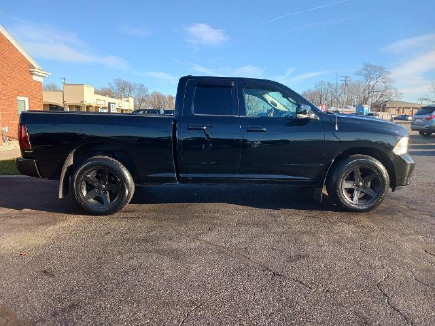 2012 Black RAM 1500 Sport Quad Cab 4WD (1C6RD7HT2CS) with an 5.7L V8 OHV 16V engine, 6-Speed Automatic transmission, located at 401 Woodman Dr, Riverside, OH, 45431, (937) 908-9800, 39.763779, -84.122063 - Photo#4