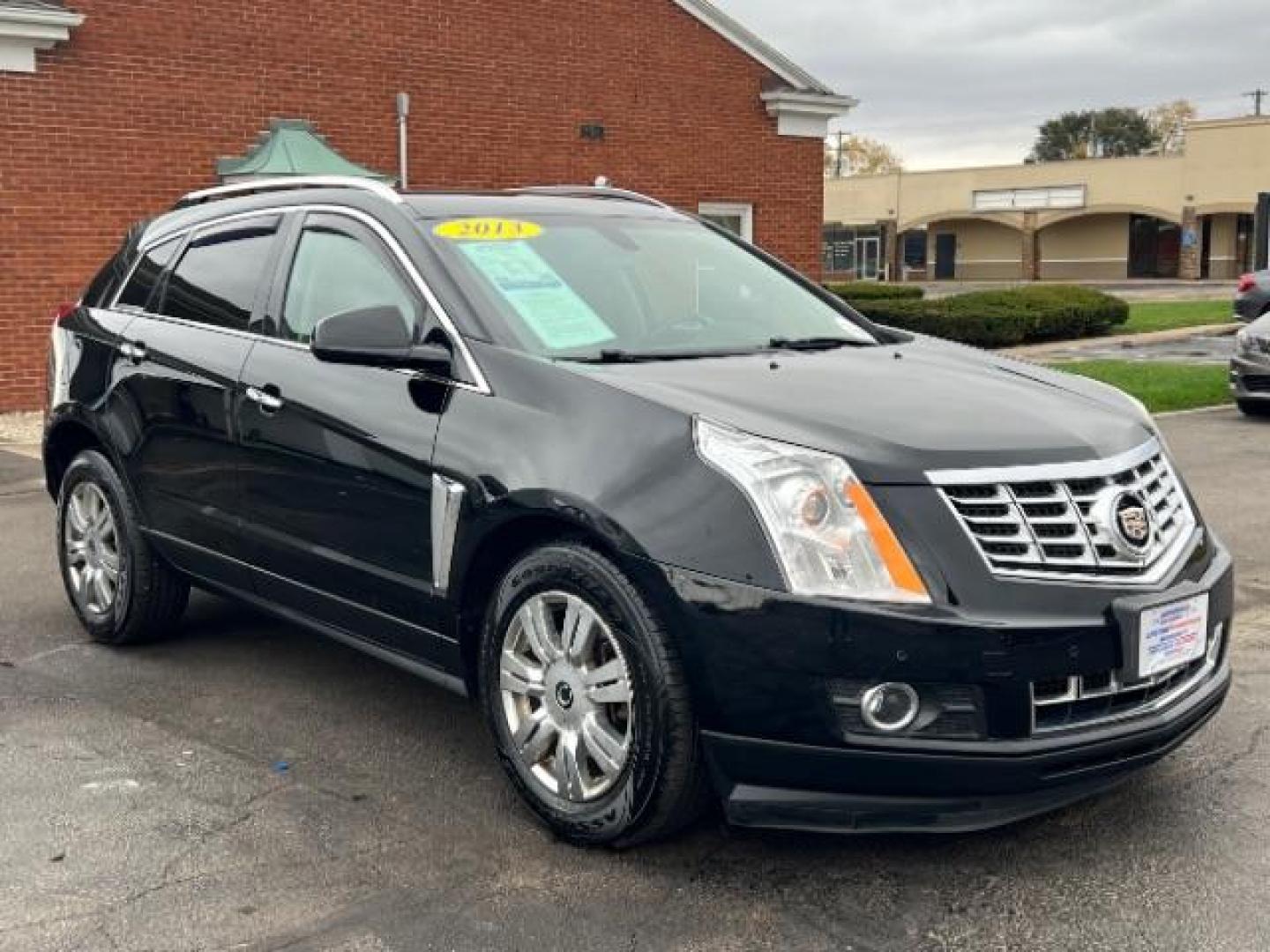 2013 Black Raven Cadillac SRX AWD Luxury Collection (3GYFNGE36DS) with an 3.6L V6 DOHC 24V FFV engine, 6-Speed Automatic transmission, located at 1184 Kauffman Ave, Fairborn, OH, 45324, (937) 908-9800, 39.807365, -84.029114 - Photo#0