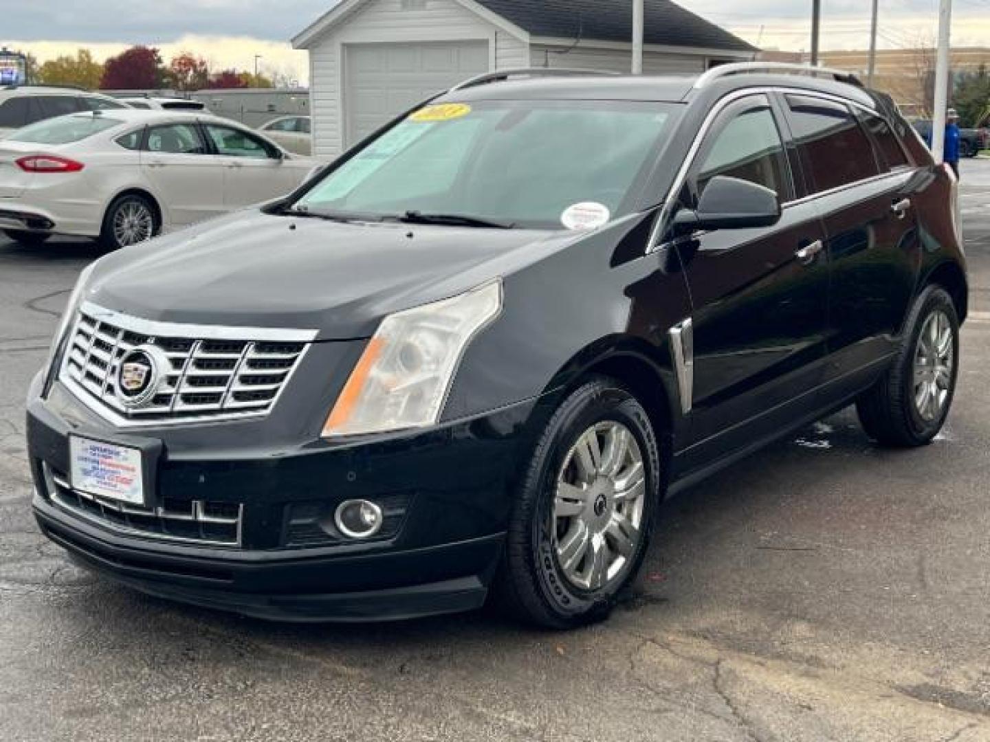 2013 Black Raven Cadillac SRX AWD Luxury Collection (3GYFNGE36DS) with an 3.6L V6 DOHC 24V FFV engine, 6-Speed Automatic transmission, located at 1184 Kauffman Ave, Fairborn, OH, 45324, (937) 908-9800, 39.807365, -84.029114 - Photo#2