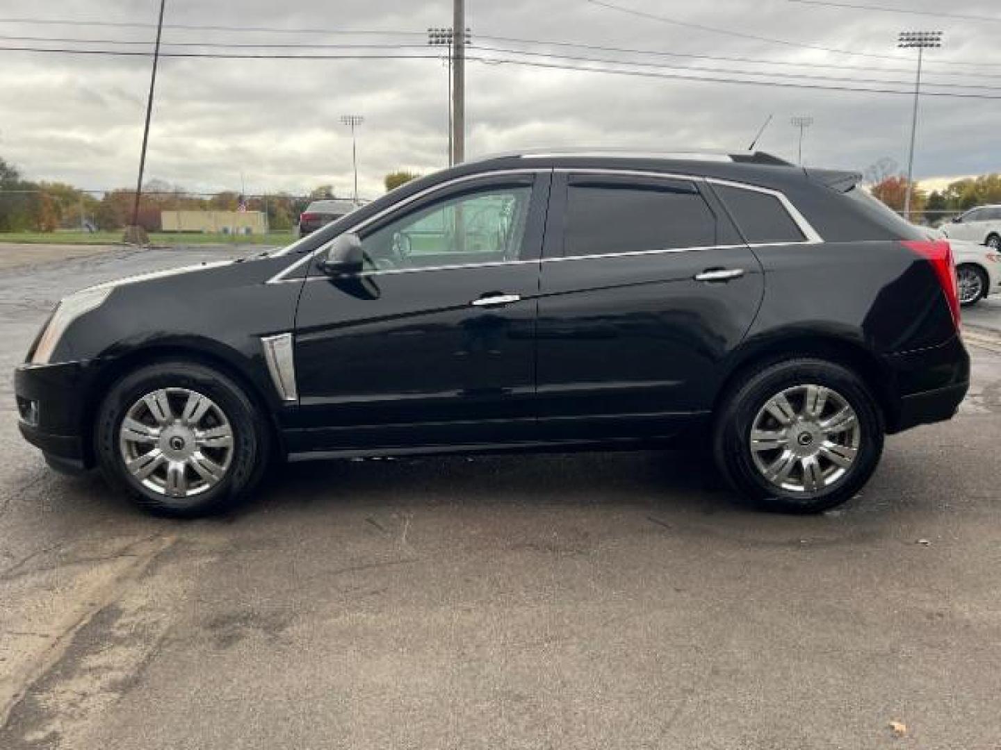 2013 Black Raven Cadillac SRX AWD Luxury Collection (3GYFNGE36DS) with an 3.6L V6 DOHC 24V FFV engine, 6-Speed Automatic transmission, located at 1184 Kauffman Ave, Fairborn, OH, 45324, (937) 908-9800, 39.807365, -84.029114 - Photo#3