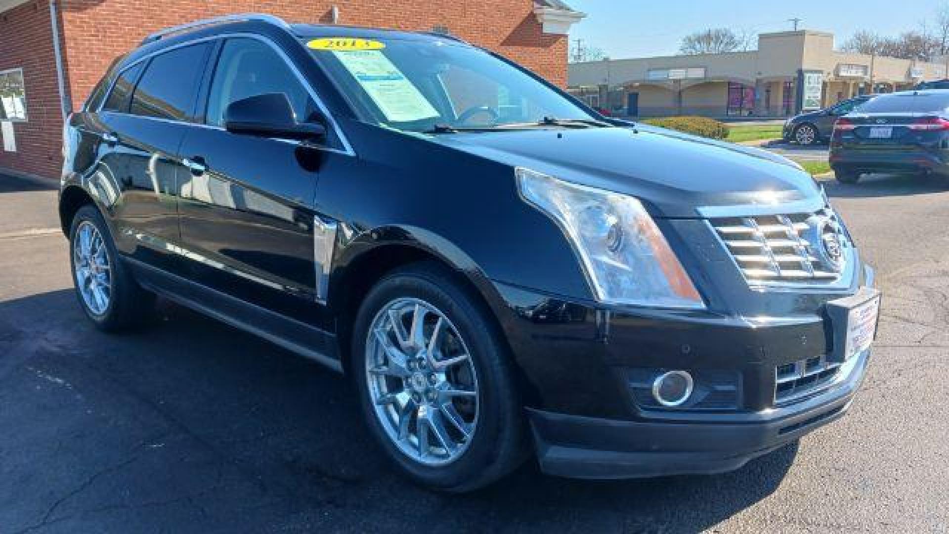 2013 Black Raven Cadillac SRX AWD Performance Collection (3GYFNHE39DS) with an 3.6L V6 DOHC 24V FFV engine, 6-Speed Automatic transmission, located at 1951 S Dayton Lakeview Rd., New Carlisle, OH, 45344, (937) 908-9800, 39.890999, -84.050255 - Photo#0