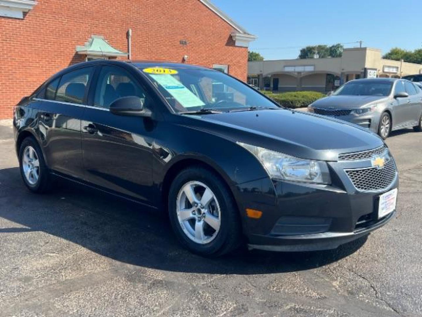 2013 Black Granite Metallic Chevrolet Cruze 1LT Auto (1G1PC5SB1D7) with an 1.4L L4 DOHC 16V TURBO engine, 6-Speed Automatic transmission, located at 880 E. National Road, Vandalia, OH, 45377, (937) 908-9800, 39.892189, -84.181015 - Photo#0