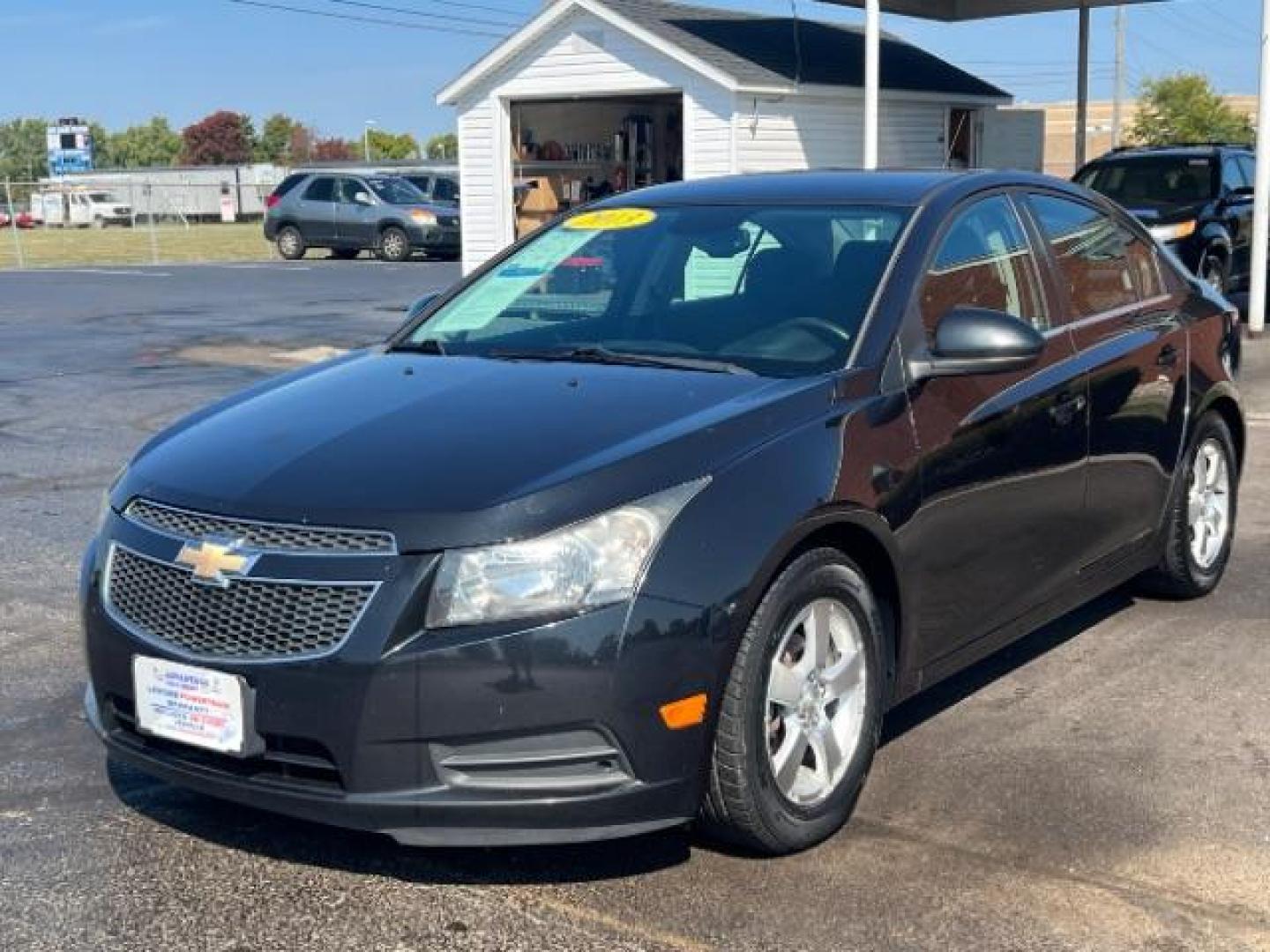 2013 Black Granite Metallic Chevrolet Cruze 1LT Auto (1G1PC5SB1D7) with an 1.4L L4 DOHC 16V TURBO engine, 6-Speed Automatic transmission, located at 880 E. National Road, Vandalia, OH, 45377, (937) 908-9800, 39.892189, -84.181015 - Photo#2