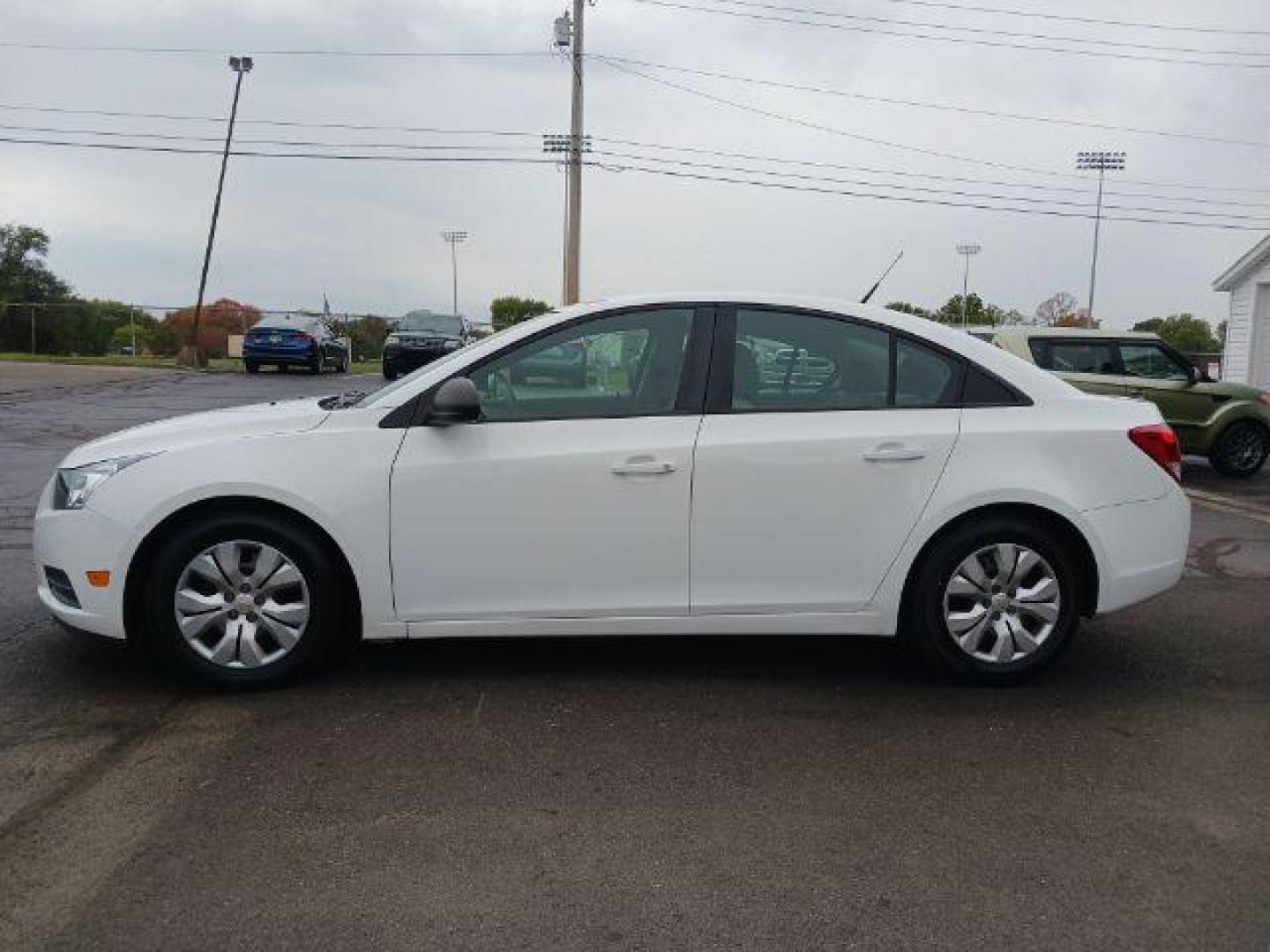 2013 Summit White Chevrolet Cruze LS Auto (1G1PA5SGXD7) with an 1.8L L4 DOHC 16V engine, 6-Speed Automatic transmission, located at 880 E. National Road, Vandalia, OH, 45377, (937) 908-9800, 39.892189, -84.181015 - Photo#3