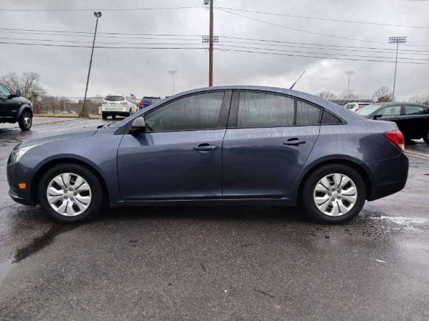 2013 Atlantis Blue Metallic Chevrolet Cruze LS Auto (1G1PA5SG9D7) with an 1.8L L4 DOHC 16V engine, 6-Speed Automatic transmission, located at 880 E. National Road, Vandalia, OH, 45377, (937) 908-9800, 39.892189, -84.181015 - Photo#3