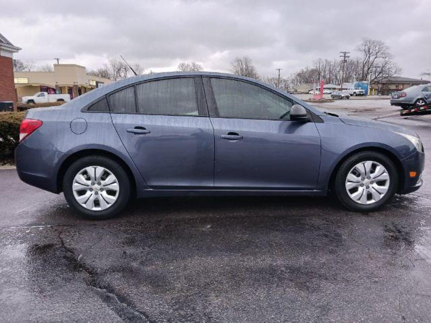 2013 Atlantis Blue Metallic Chevrolet Cruze LS Auto (1G1PA5SG9D7) with an 1.8L L4 DOHC 16V engine, 6-Speed Automatic transmission, located at 880 E. National Road, Vandalia, OH, 45377, (937) 908-9800, 39.892189, -84.181015 - Photo#4