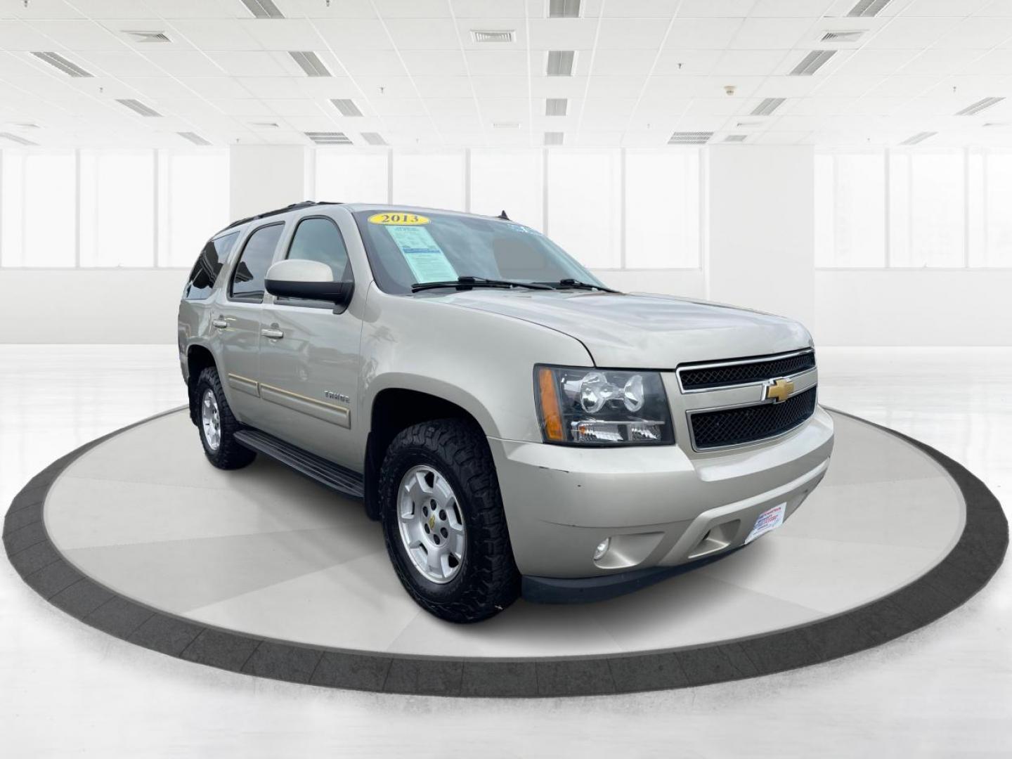 2013 Champagne Silver Metallic Chevrolet Tahoe (1GNSKBE03DR) with an 5.3L V8 OHV 16V FFV engine, 6-Speed Automatic transmission, located at 1230 East Main St, Xenia, OH, 45385, (937) 908-9800, 39.687321, -83.910294 - Photo#0