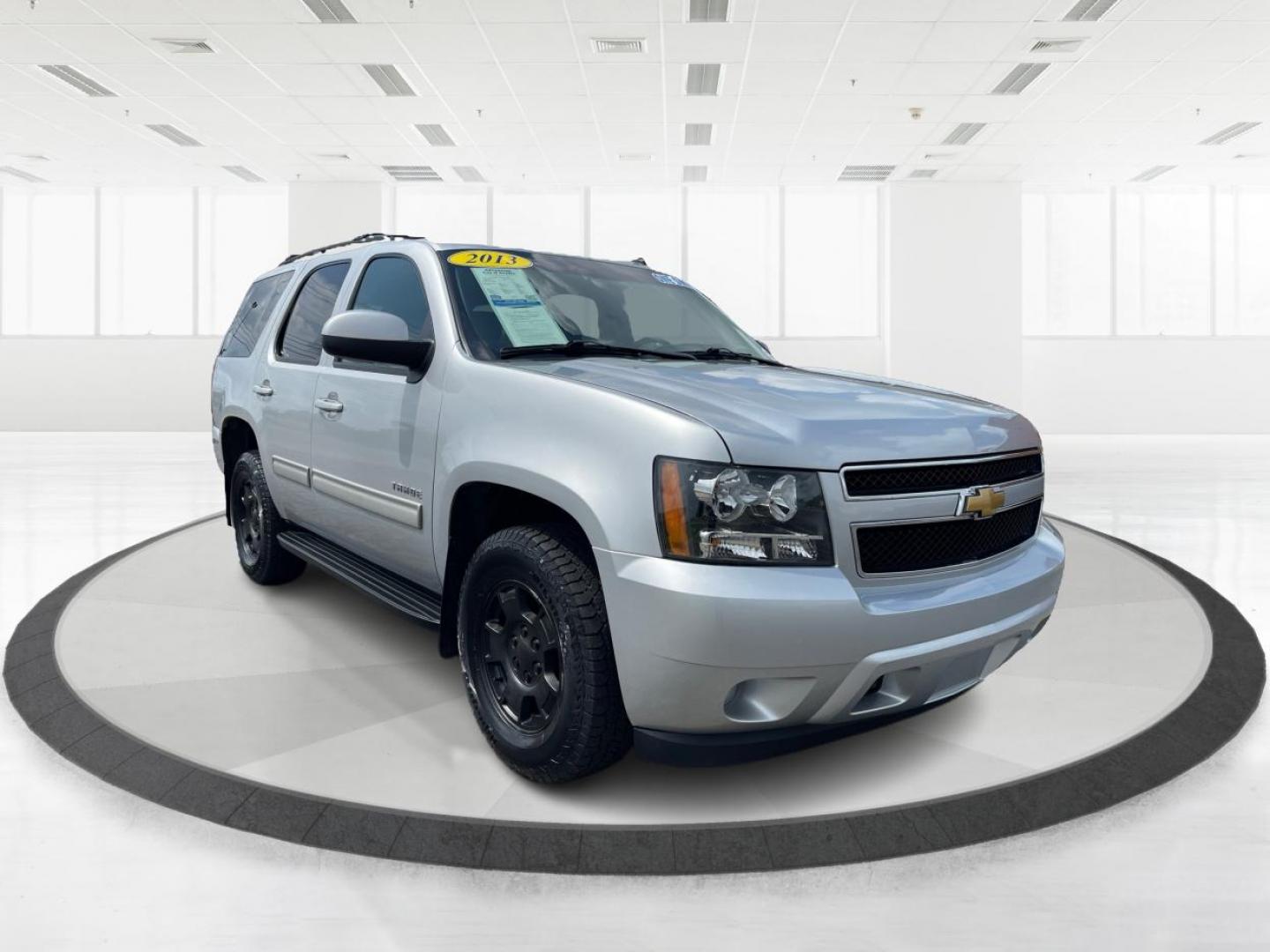 2013 Silver Ice Metallic Chevrolet Tahoe (1GNSKAE04DR) with an 5.3L V8 OHV 16V FFV engine, 6-Speed Automatic transmission, located at 1951 S Dayton Lakeview Rd., New Carlisle, OH, 45344, (937) 908-9800, 39.890999, -84.050255 - Photo#0