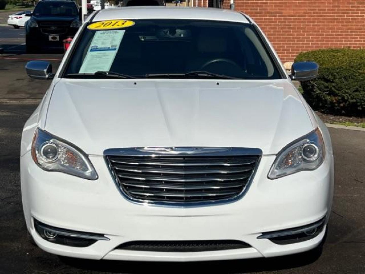 2013 Bright White Chrysler 200 Limited (1C3CCBCG9DN) with an 3.6L V6 DOHC 24V FFV engine, 6-Speed Automatic transmission, located at 1184 Kauffman Ave, Fairborn, OH, 45324, (937) 908-9800, 39.807365, -84.029114 - Photo#1