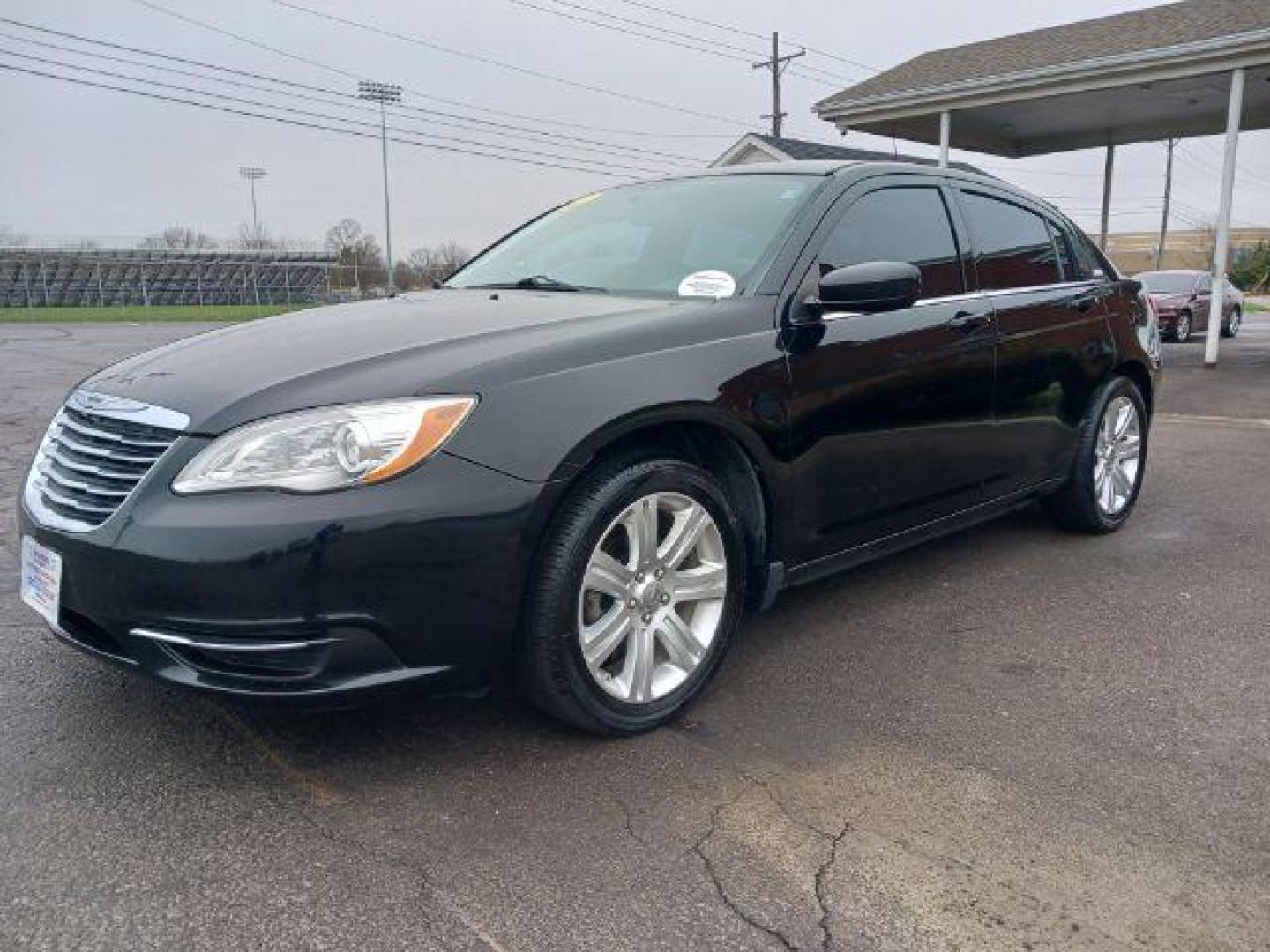 2013 Black Chrysler 200 Touring (1C3CCBBB8DN) with an 2.4L L4 DOHC 16V engine, 6-Speed Automatic transmission, located at 401 Woodman Dr, Riverside, OH, 45431, (937) 908-9800, 39.763779, -84.122063 - Photo#2