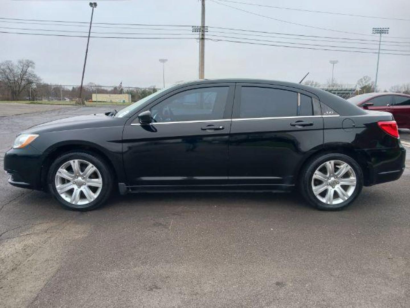 2013 Black Chrysler 200 Touring (1C3CCBBB8DN) with an 2.4L L4 DOHC 16V engine, 6-Speed Automatic transmission, located at 401 Woodman Dr, Riverside, OH, 45431, (937) 908-9800, 39.763779, -84.122063 - Photo#3