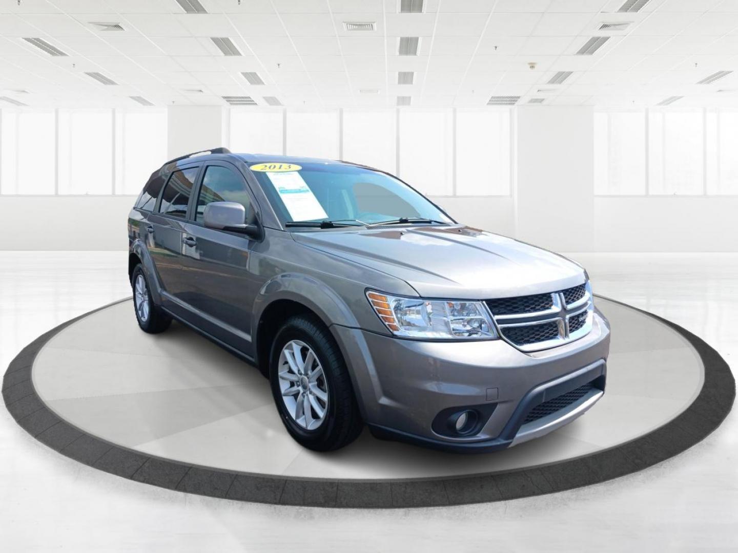 2013 Storm Grey Pearl Dodge Journey SXT (3C4PDCBB2DT) with an 2.4L L6 DOHC 16V engine, 4-Speed Automatic transmission, located at 1951 S Dayton Lakeview Rd., New Carlisle, OH, 45344, (937) 908-9800, 39.890999, -84.050255 - Photo#0