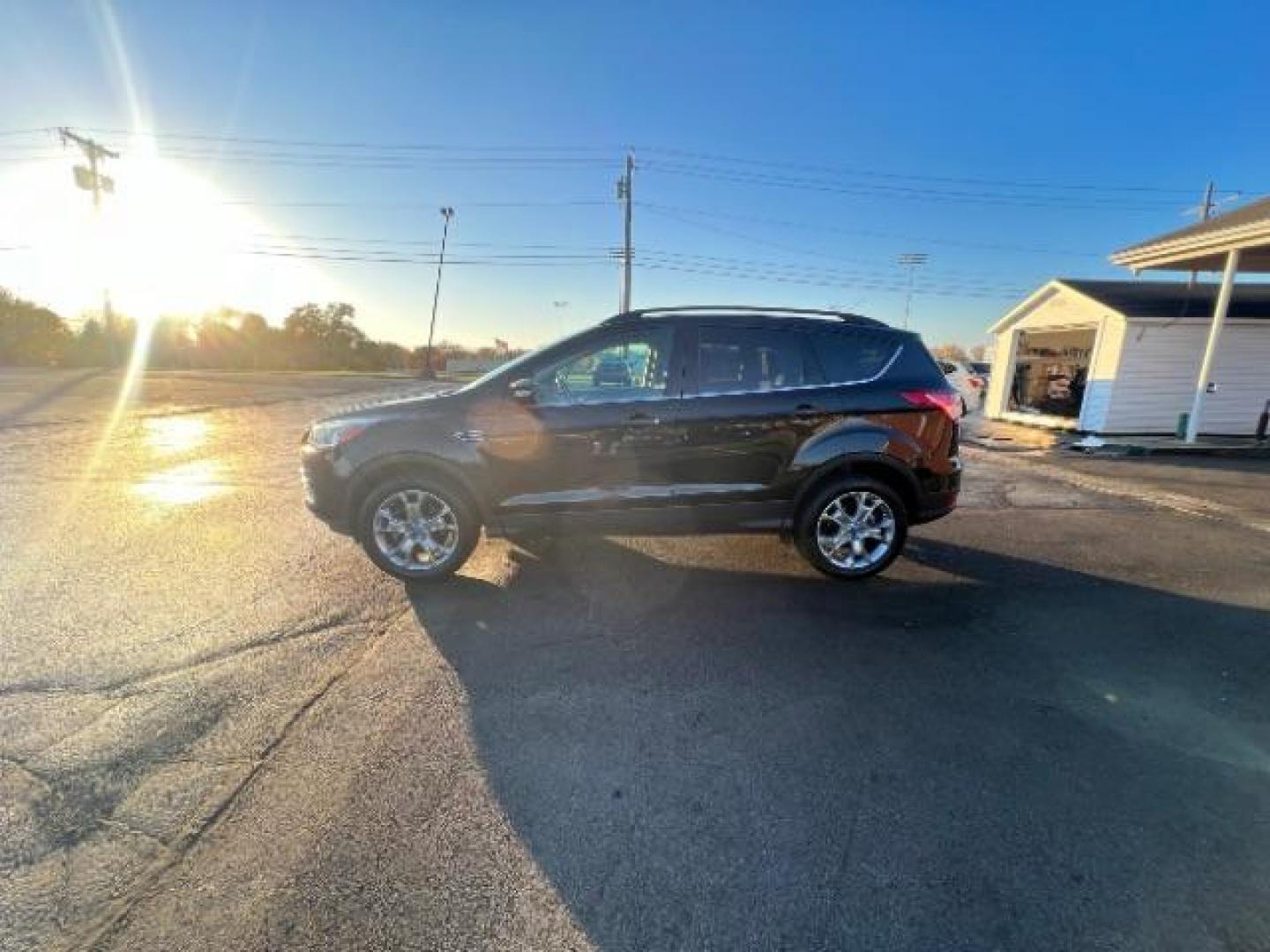 2013 Tuxedo Black Ford Escape SEL 4WD (1FMCU9H95DU) with an 2.0L L4 DOHC 16V engine, 6-Speed Automatic transmission, located at 401 Woodman Dr, Riverside, OH, 45431, (937) 908-9800, 39.763779, -84.122063 - Photo#3