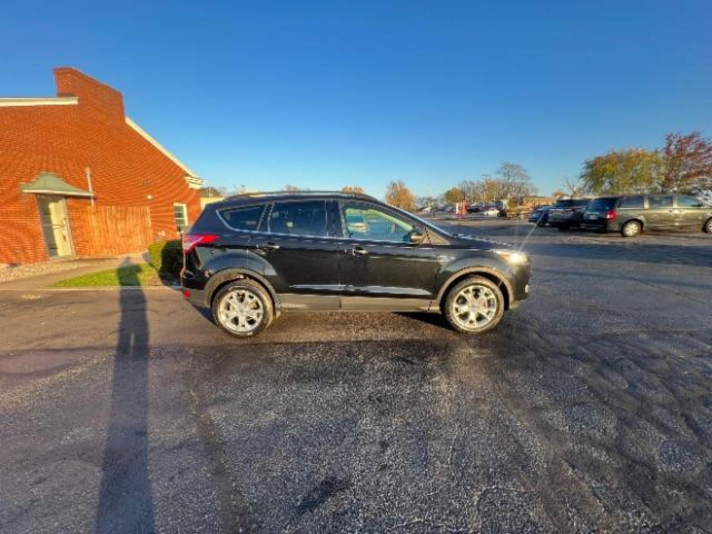 2013 Tuxedo Black Ford Escape SEL 4WD (1FMCU9H95DU) with an 2.0L L4 DOHC 16V engine, 6-Speed Automatic transmission, located at 401 Woodman Dr, Riverside, OH, 45431, (937) 908-9800, 39.763779, -84.122063 - Photo#5