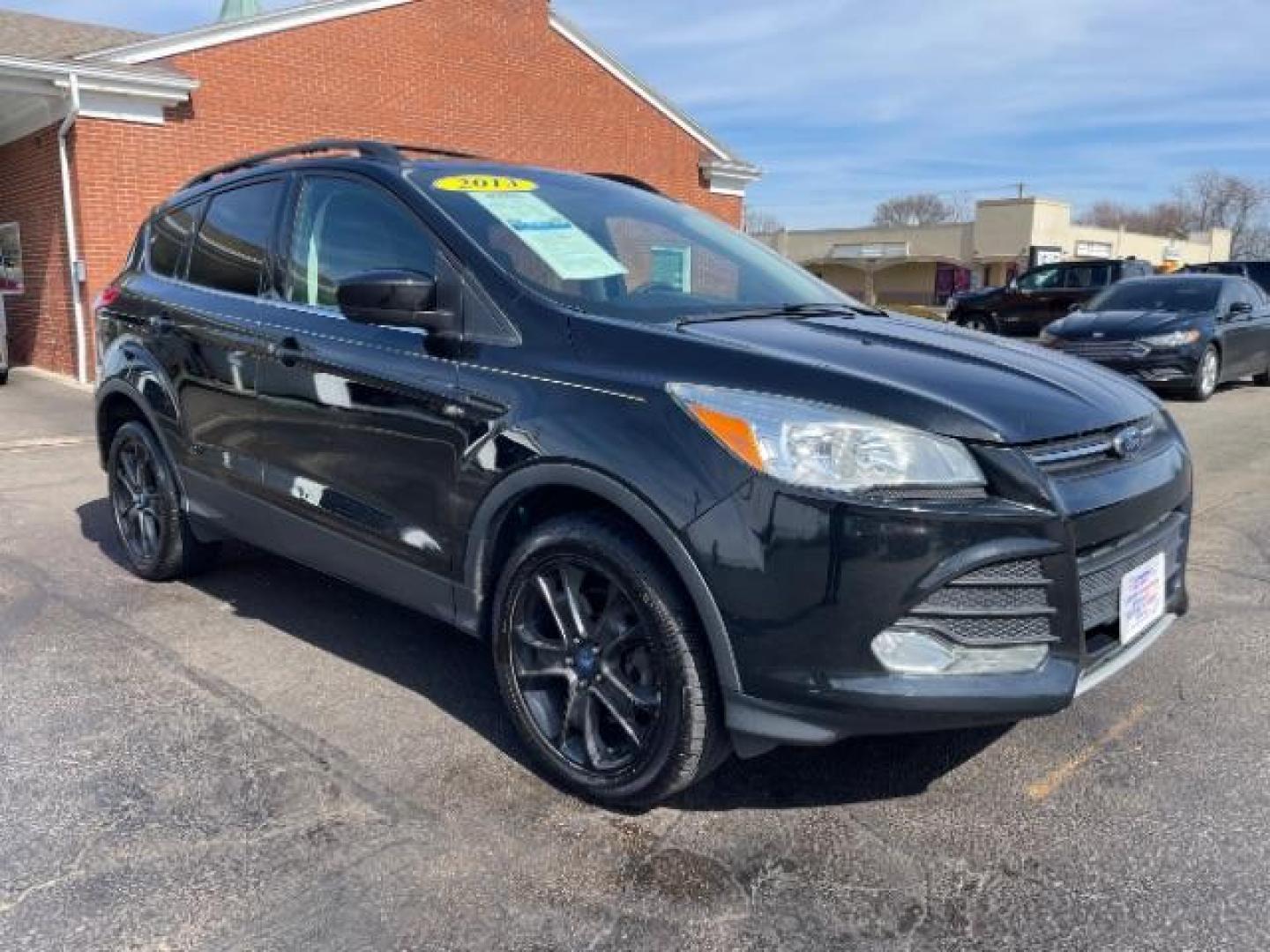 2013 Tuxedo Black Ford Escape SE 4WD (1FMCU9G96DU) with an 2.0L L4 DOHC 16V engine, 6-Speed Automatic transmission, located at 1951 S Dayton Lakeview Rd., New Carlisle, OH, 45344, (937) 908-9800, 39.890999, -84.050255 - Photo#0